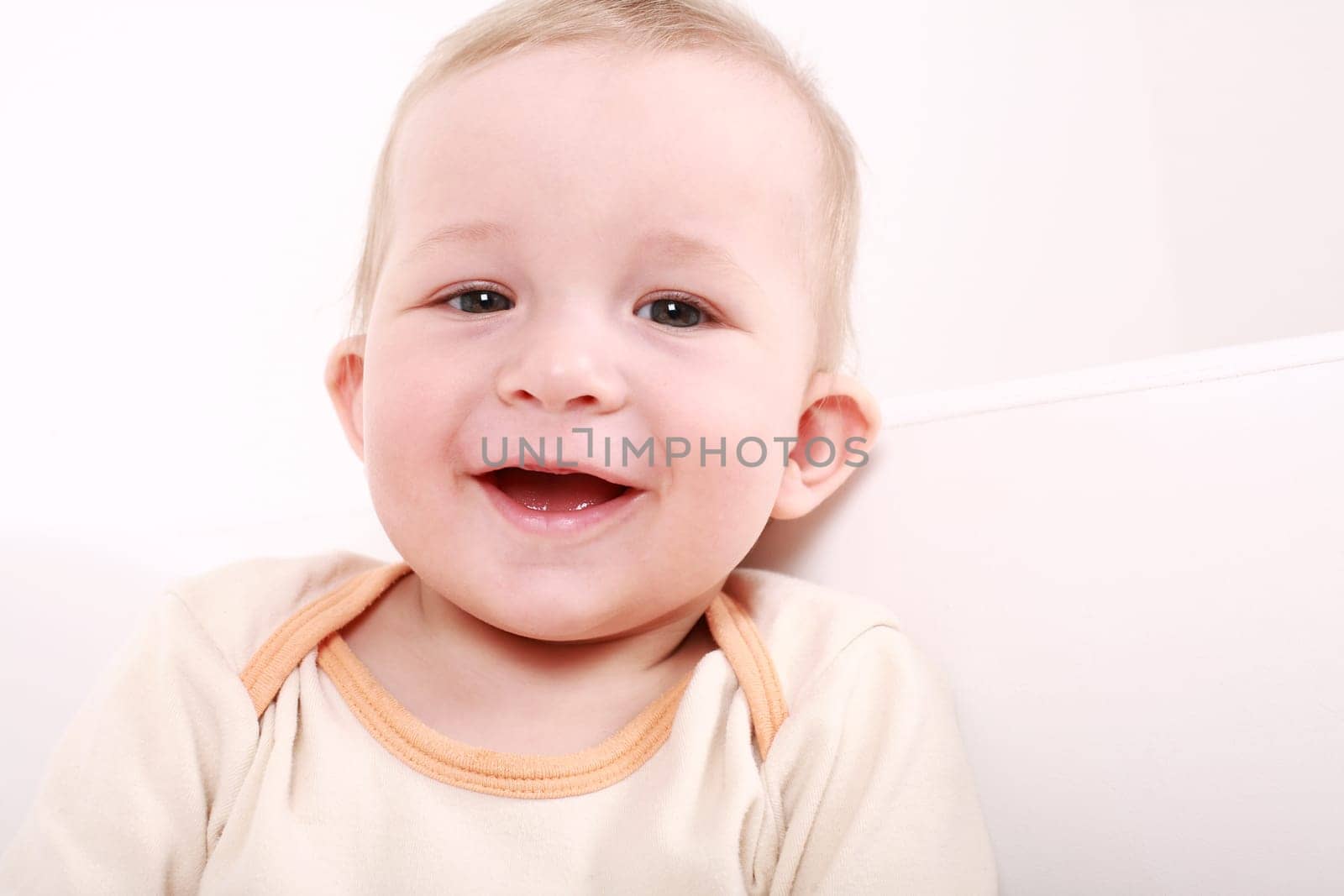 Portrait of cute newborn laughing