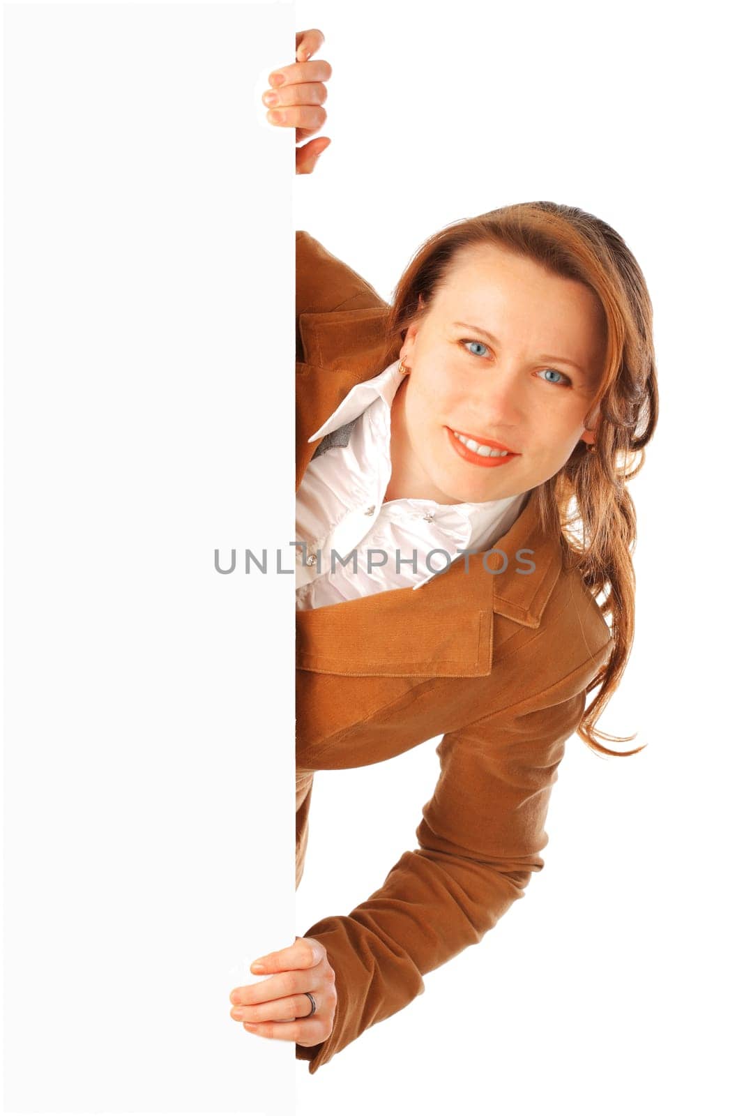 Portrait of a young attractive smiling business woman holding a big poster on one side, isolated over white background