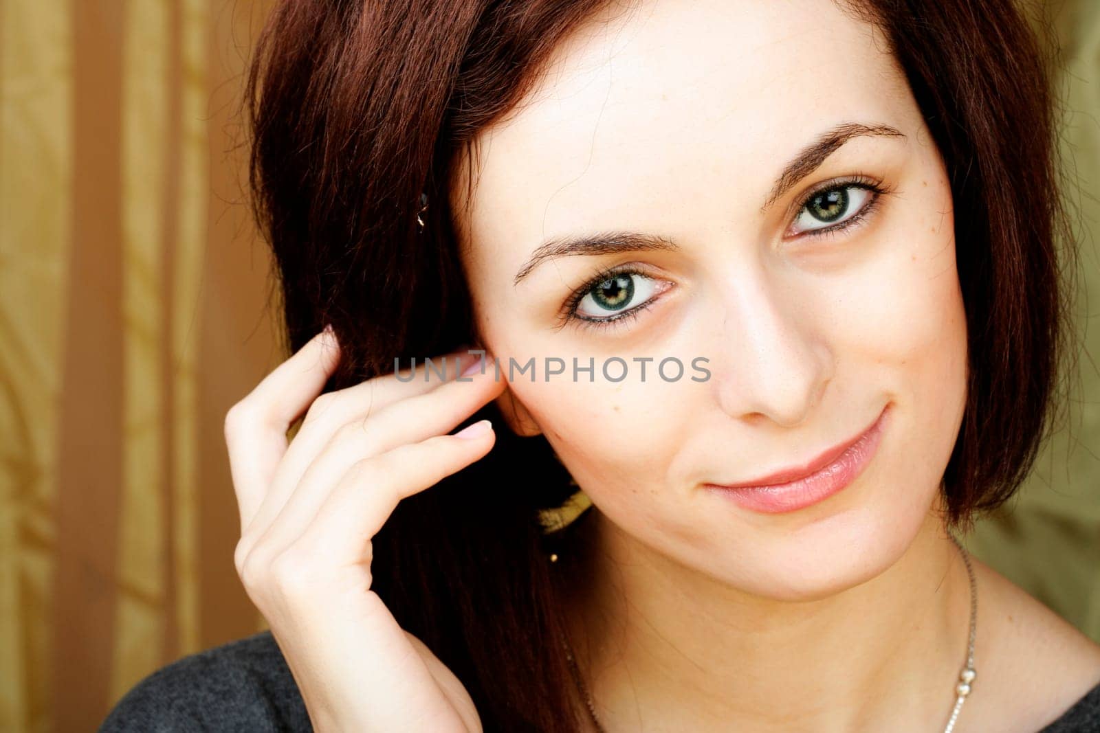 Beautiful happy woman with green eyes.