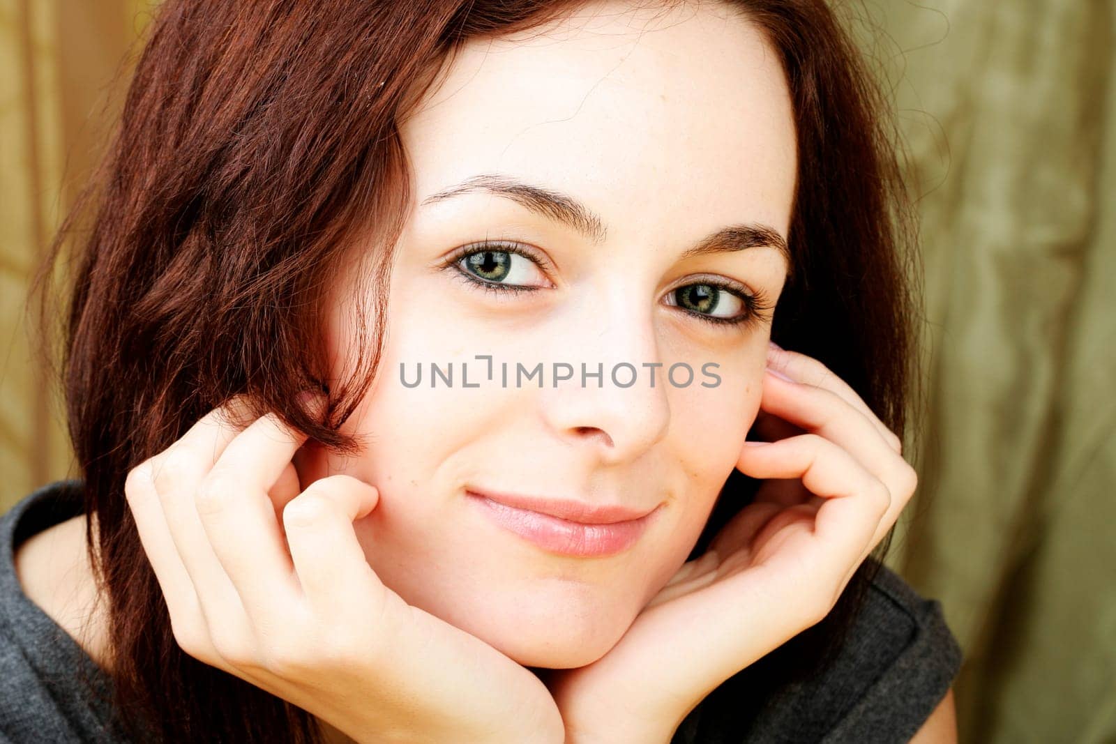 Beautiful happy woman with green eyes.