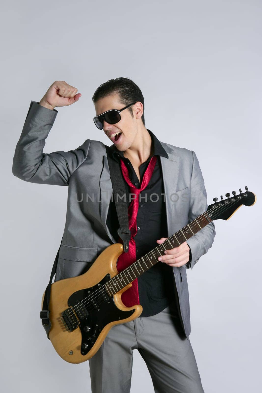 Businessman musician playing instrument with suit and tie