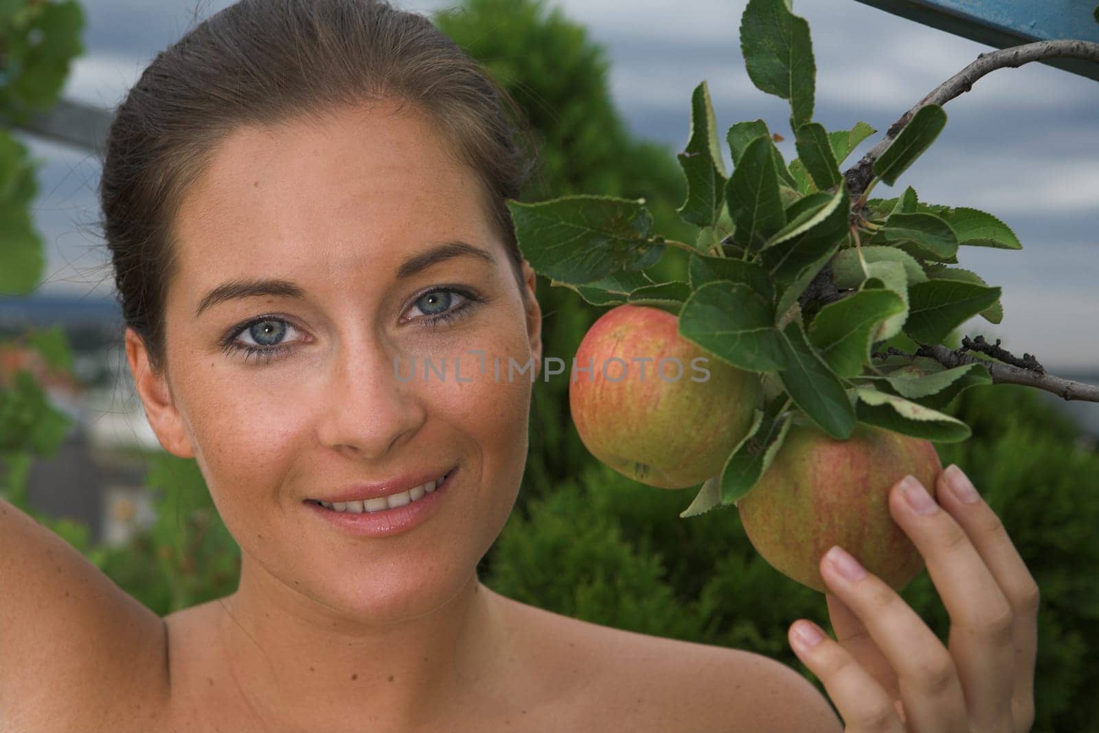 Young attractive Woman with apple in her hand