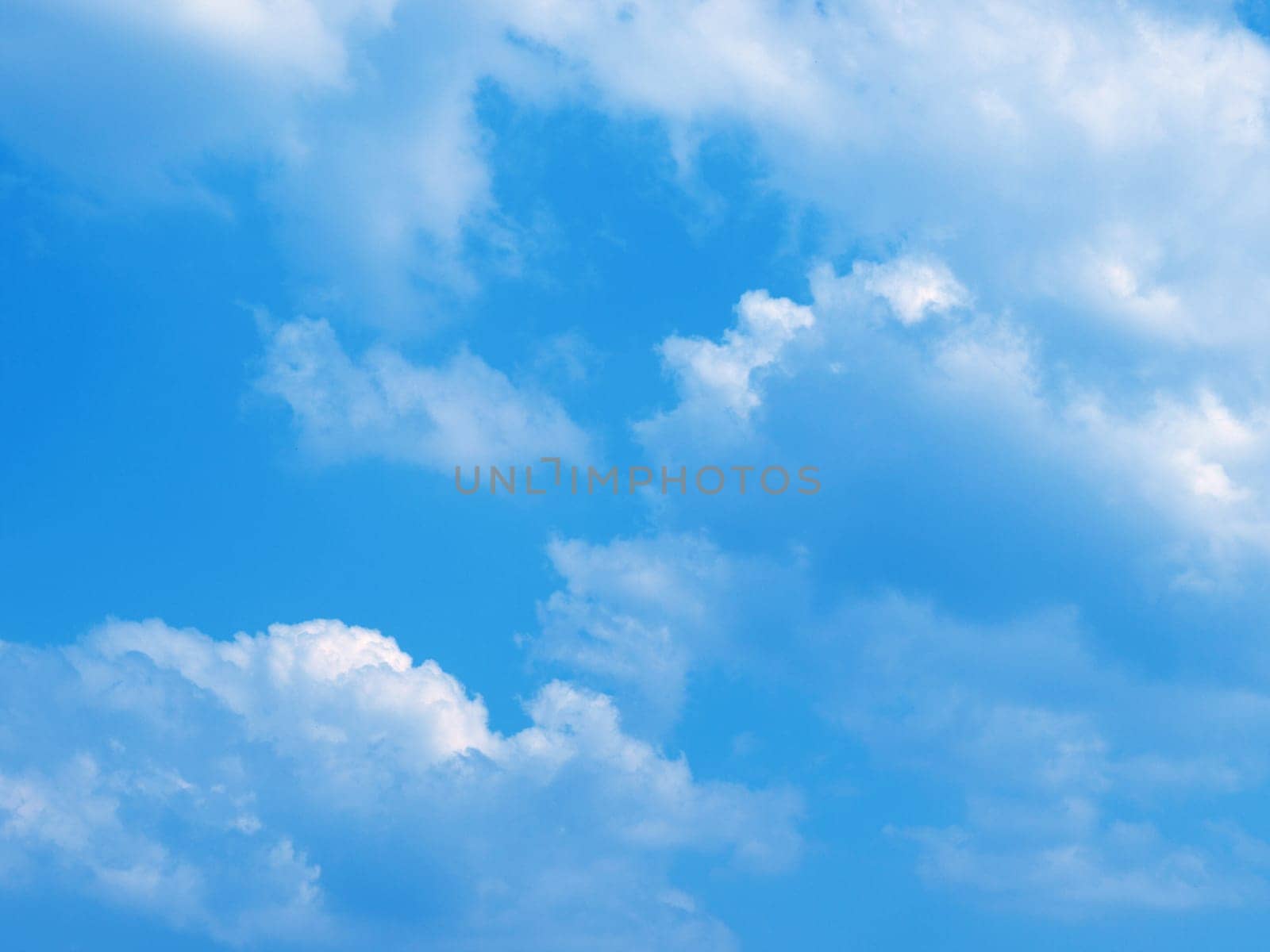 Blue sky with white clouds useful as a background