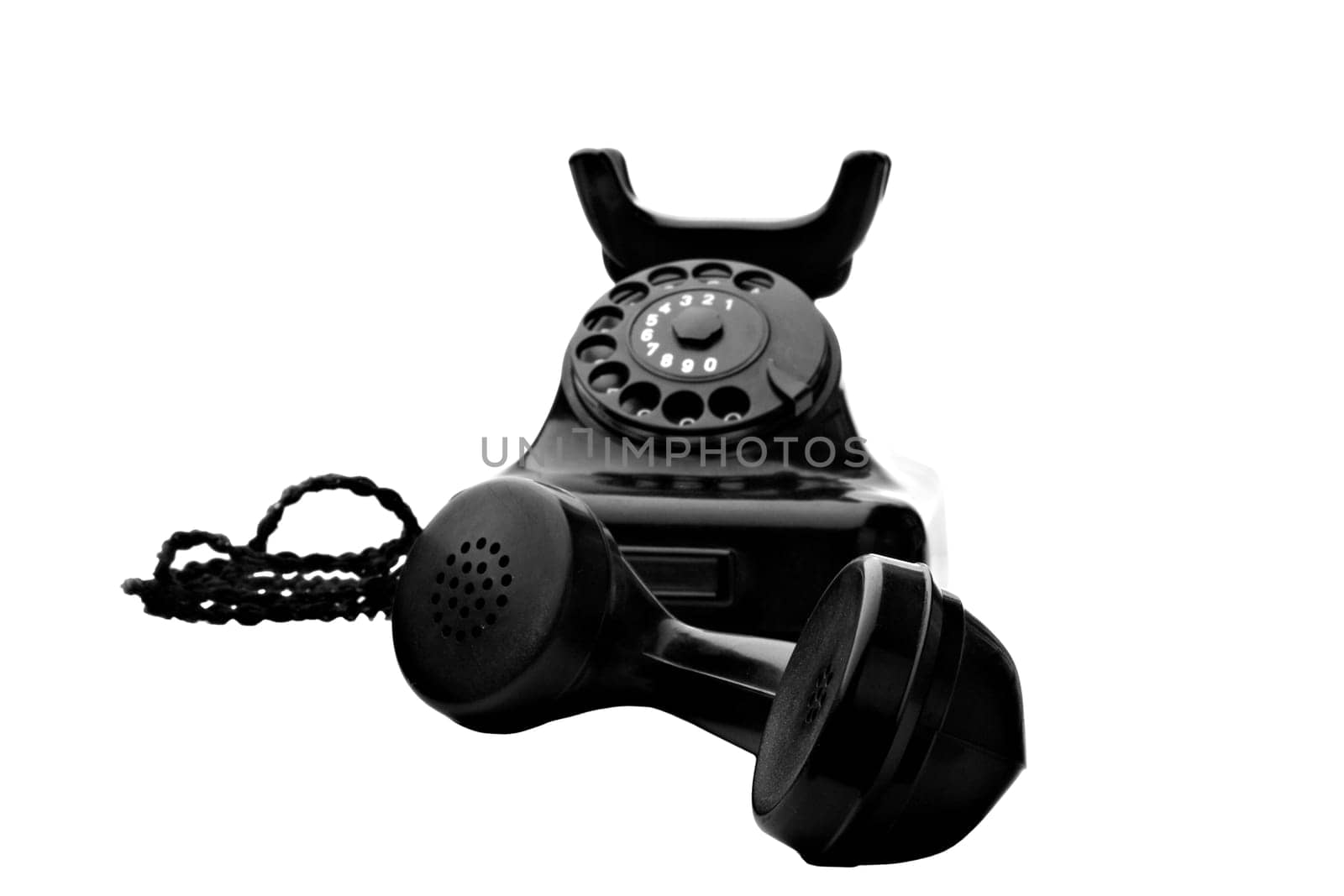 old vintage black rotary telephone isolated on white