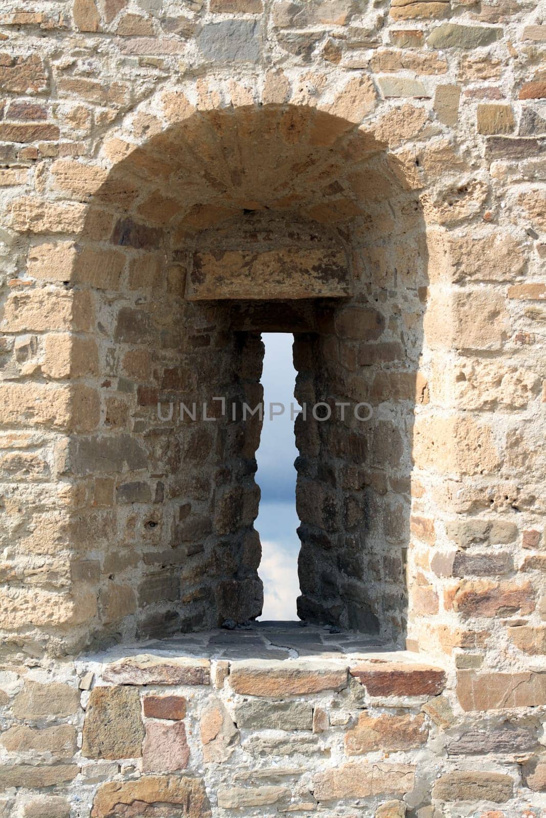 Closeup of ancient fortress wall with embrasure. Object with clipping path
