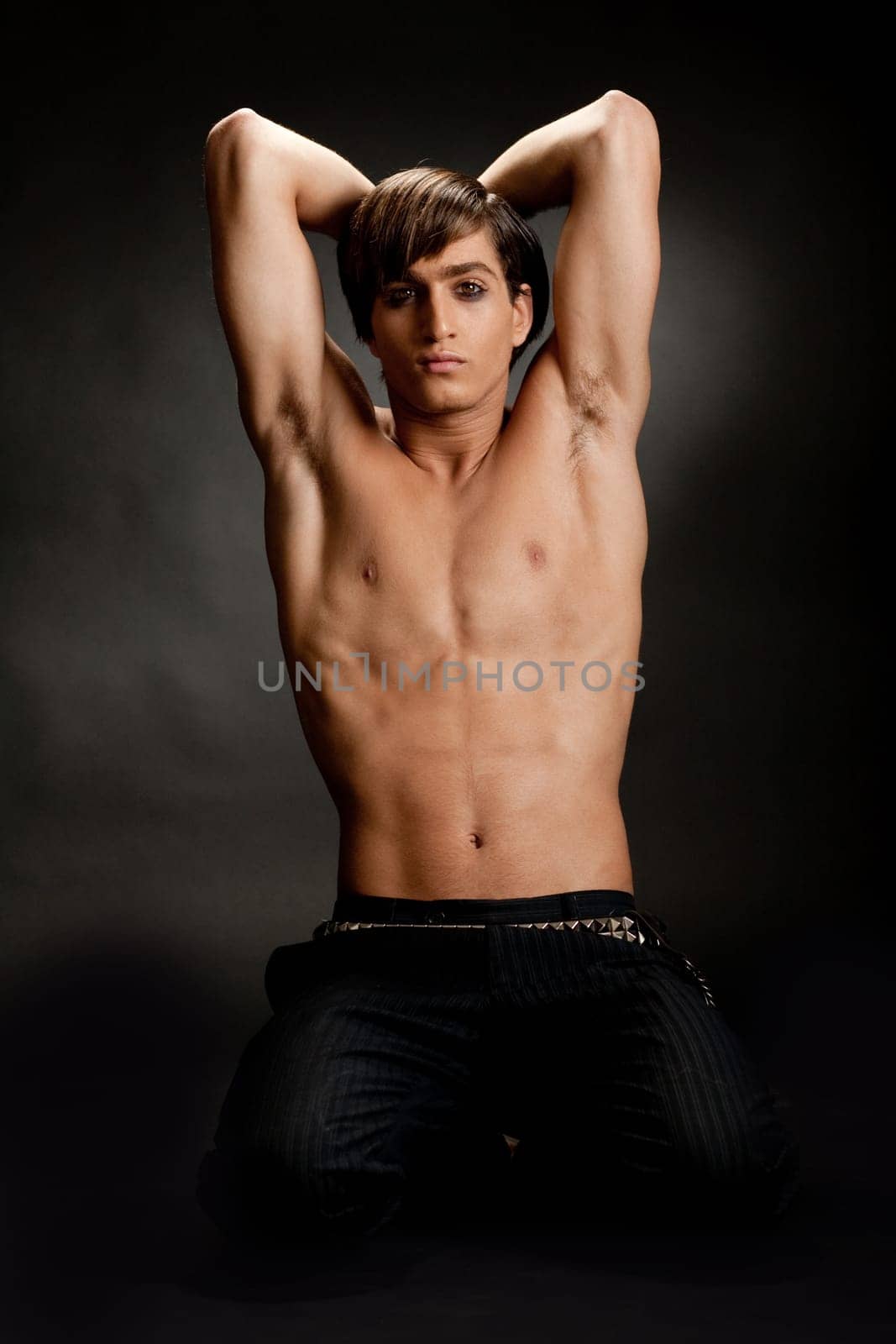 Strong and muscular man posing