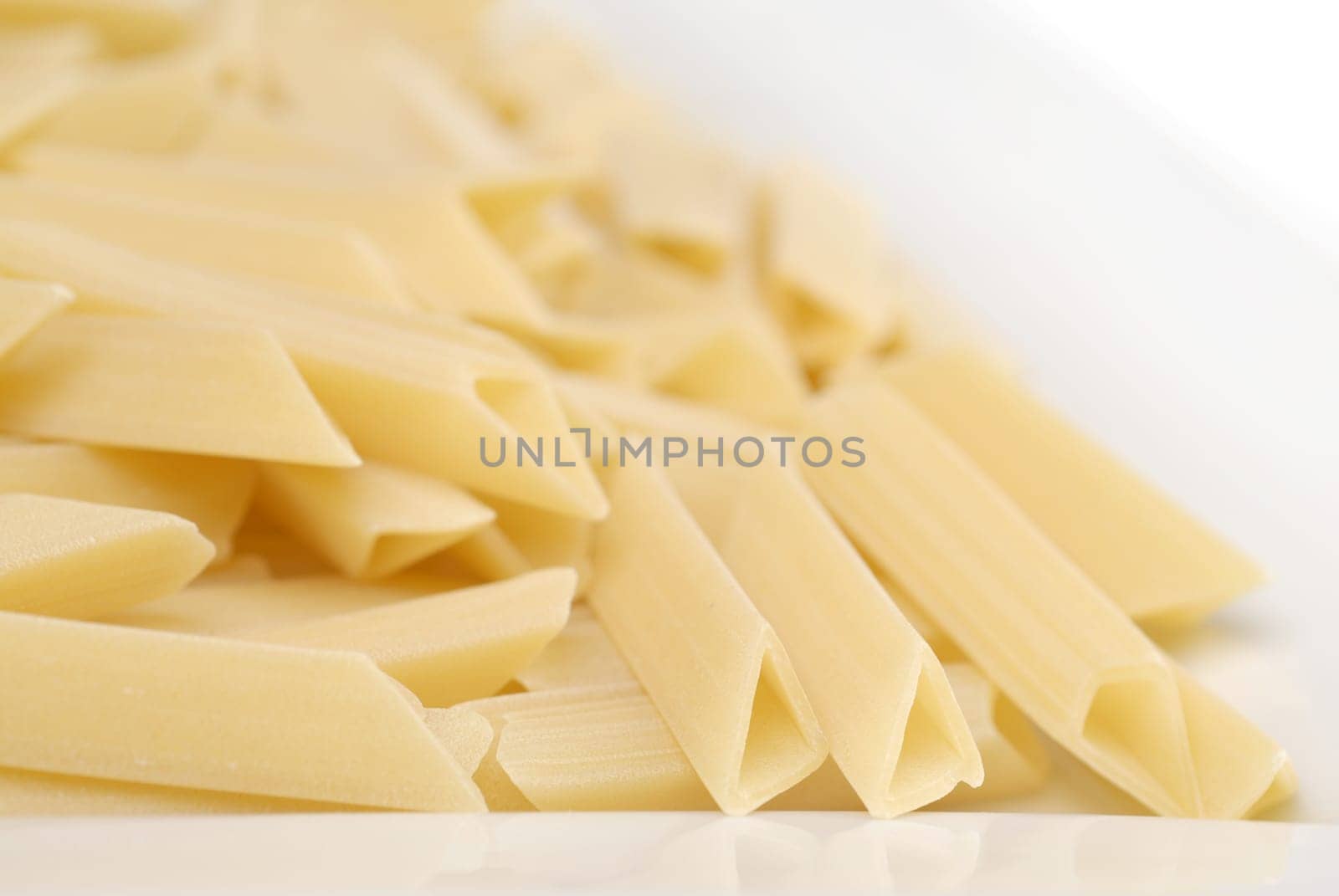 raw macaroni on the white table