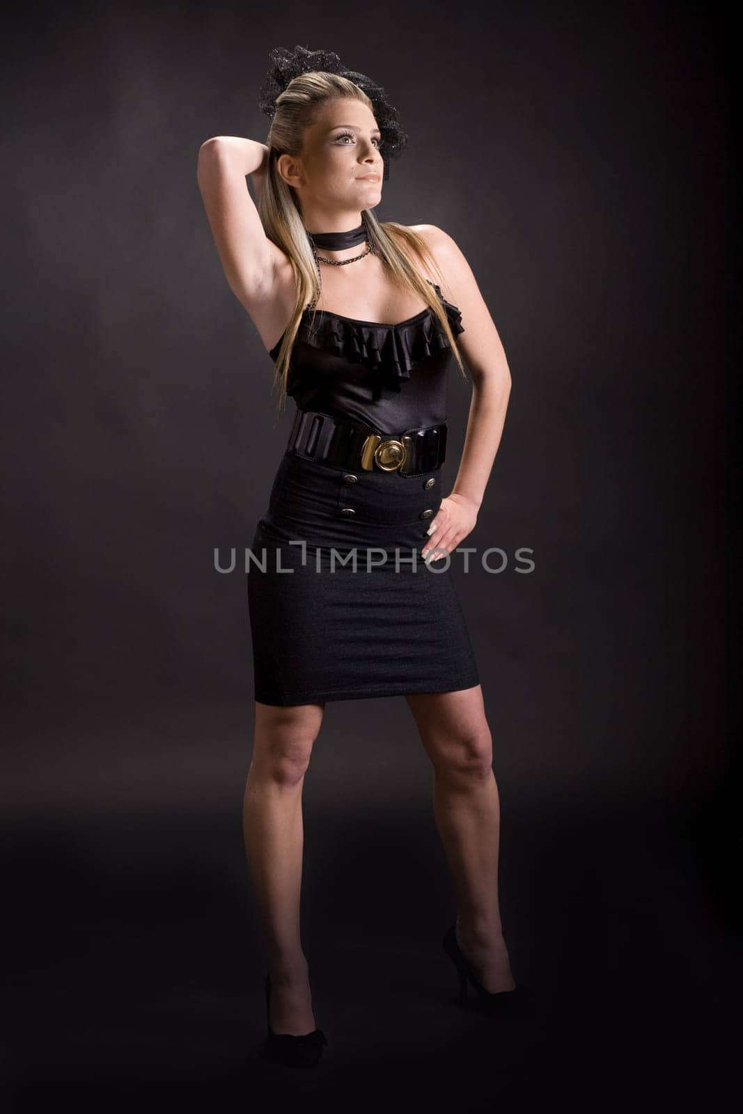 Attractive young woman isolated on black background