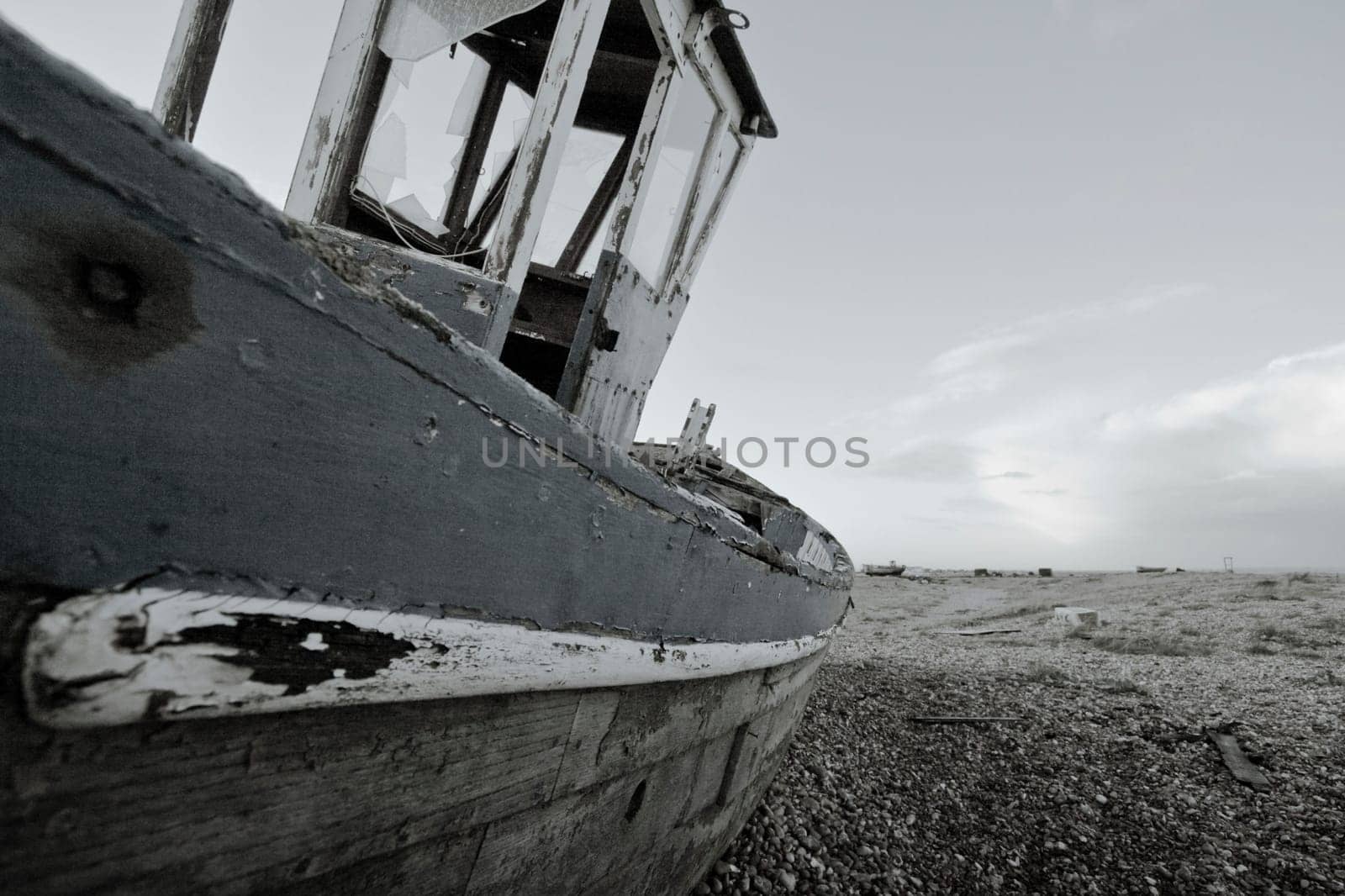Old boat laying on land