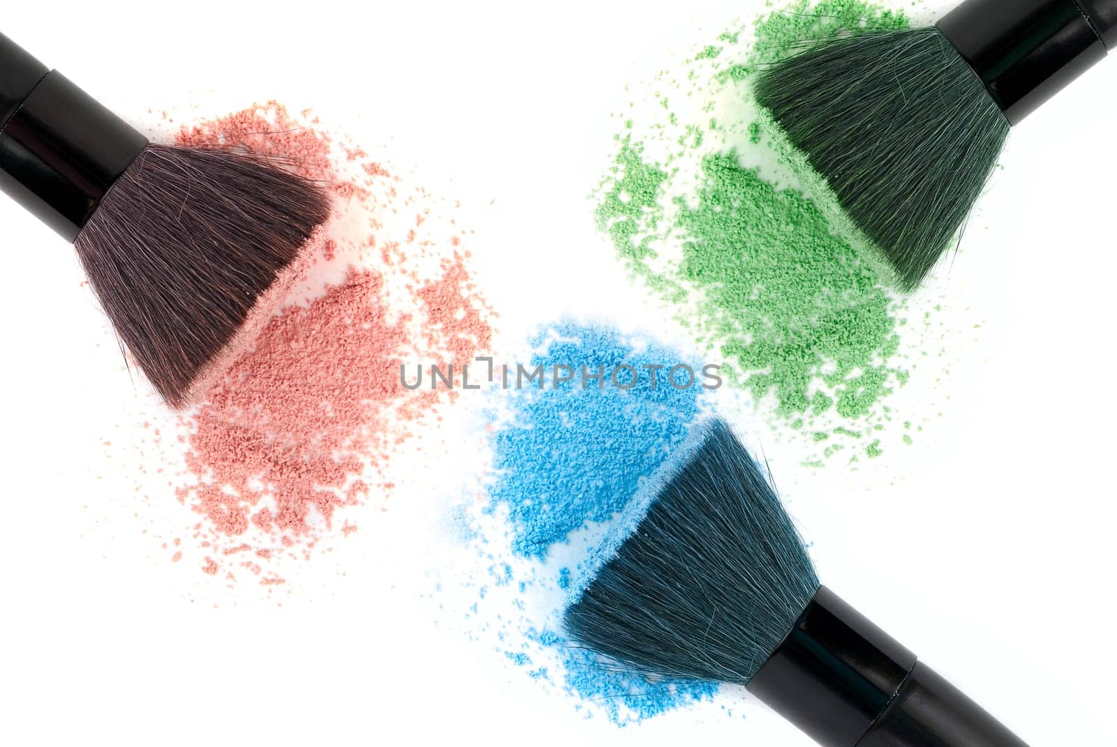 Three color powders set and black brush isolated