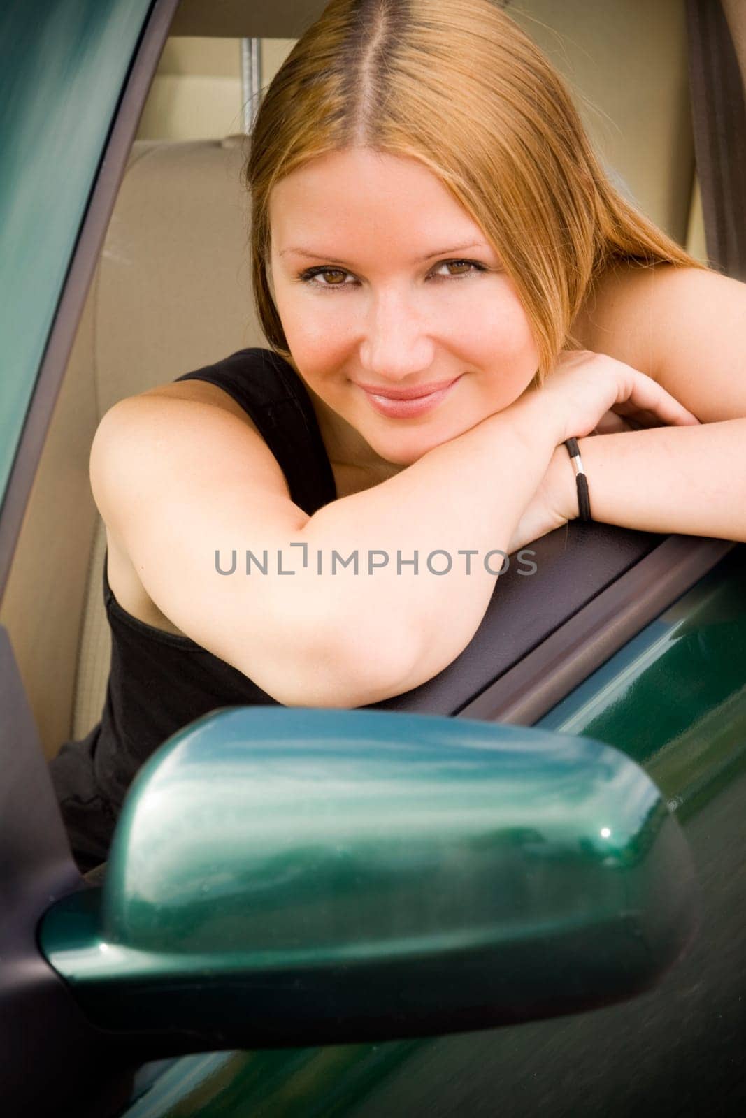 pretty woman looking in the car window