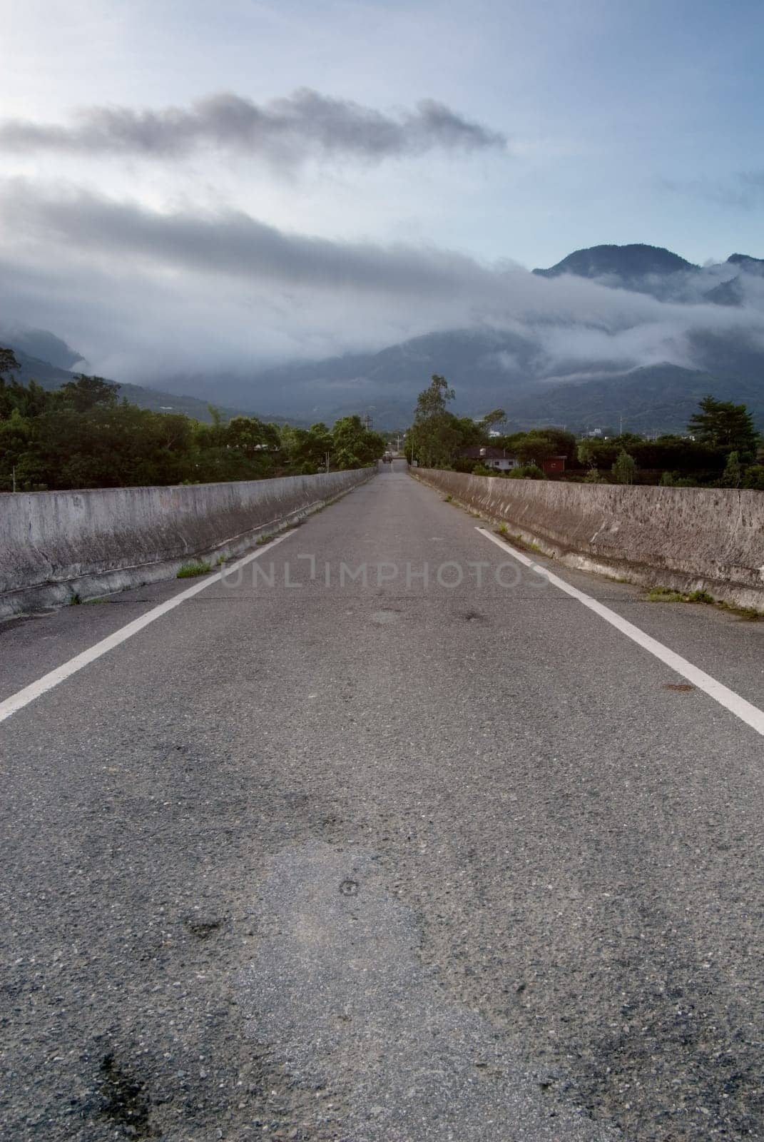 It is a contry road in the morning.