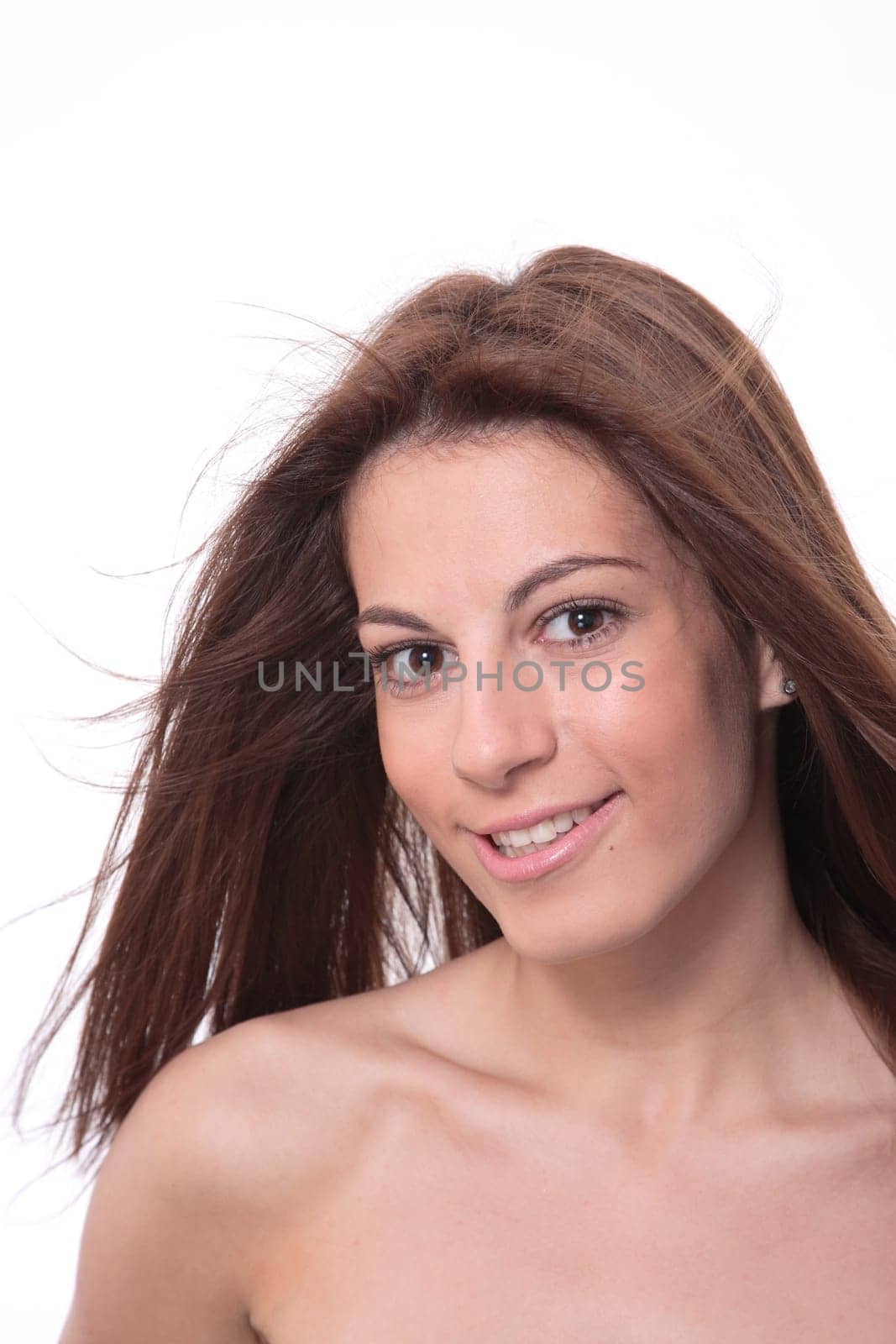 Closeup portrait of a happy young woman smiling isolated on white background