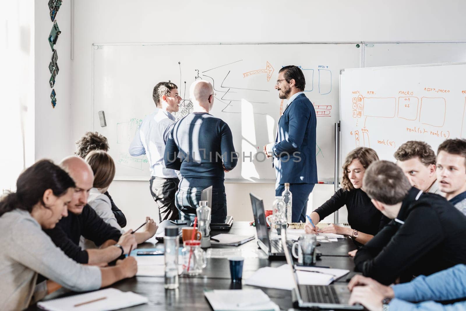 Relaxed informal IT business startup company meeting. Team leaders discussing and brainstorming new approaches and ideas with colleagues. Startup business and entrepreneurship concept.