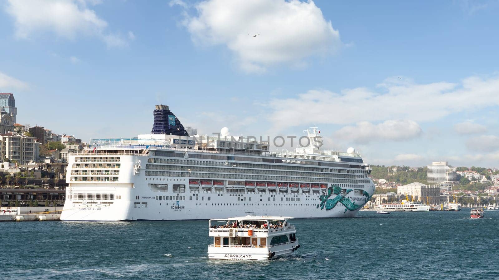 Istanbul, Turkey - May 7, 2023: Norwegian Jade, Huge cruise ship docked at Galataport terminal along the Bosphorus, in Karakoy neighbourhood