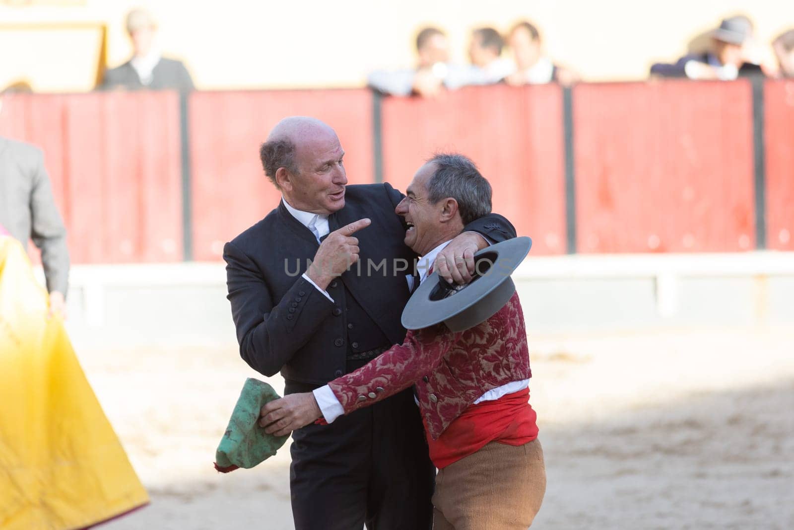 March 26, 2023 Lisbon, Portugal: Tourada - two elderly men forcado and cavaleiro on the arena. Mid shot