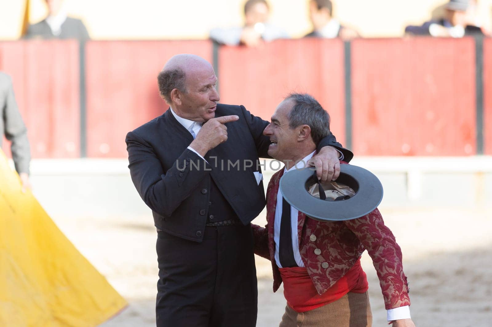 March 26, 2023 Lisbon, Portugal: Tourada - elderly forcado and cavaleiro on the arena. Mid shot