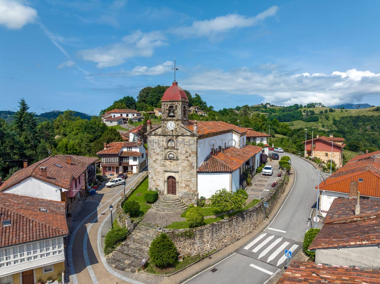 Aerial view of 16th-century San Martín el Real Church in Torazo, Asturias. A serene blend of historic charm and scenic beauty. Nominated Pretty Town