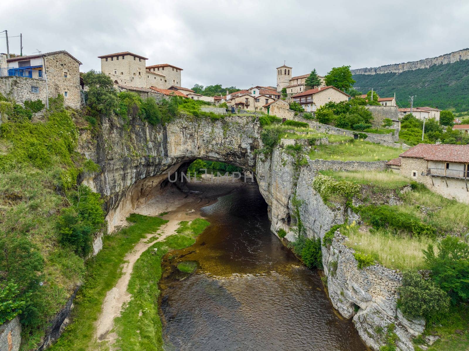 Beautiful view of Puentedey, a picturesque village with a natural bridge over the river. Merindades, Burgos, Spain, One of the Beautiful Towns