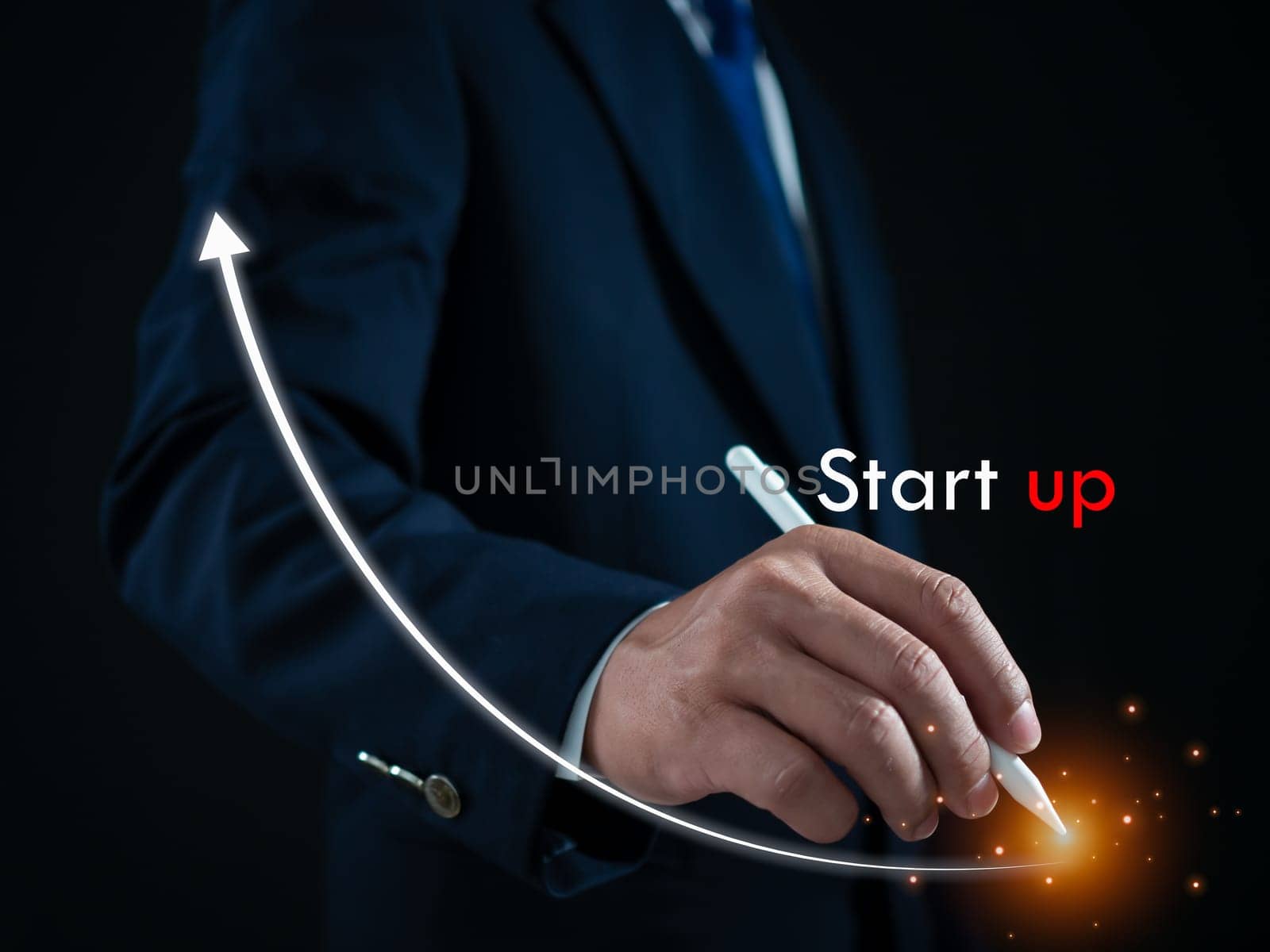 Businessman presses the pen at the starting point to start a business. Startup concept. Business concept.