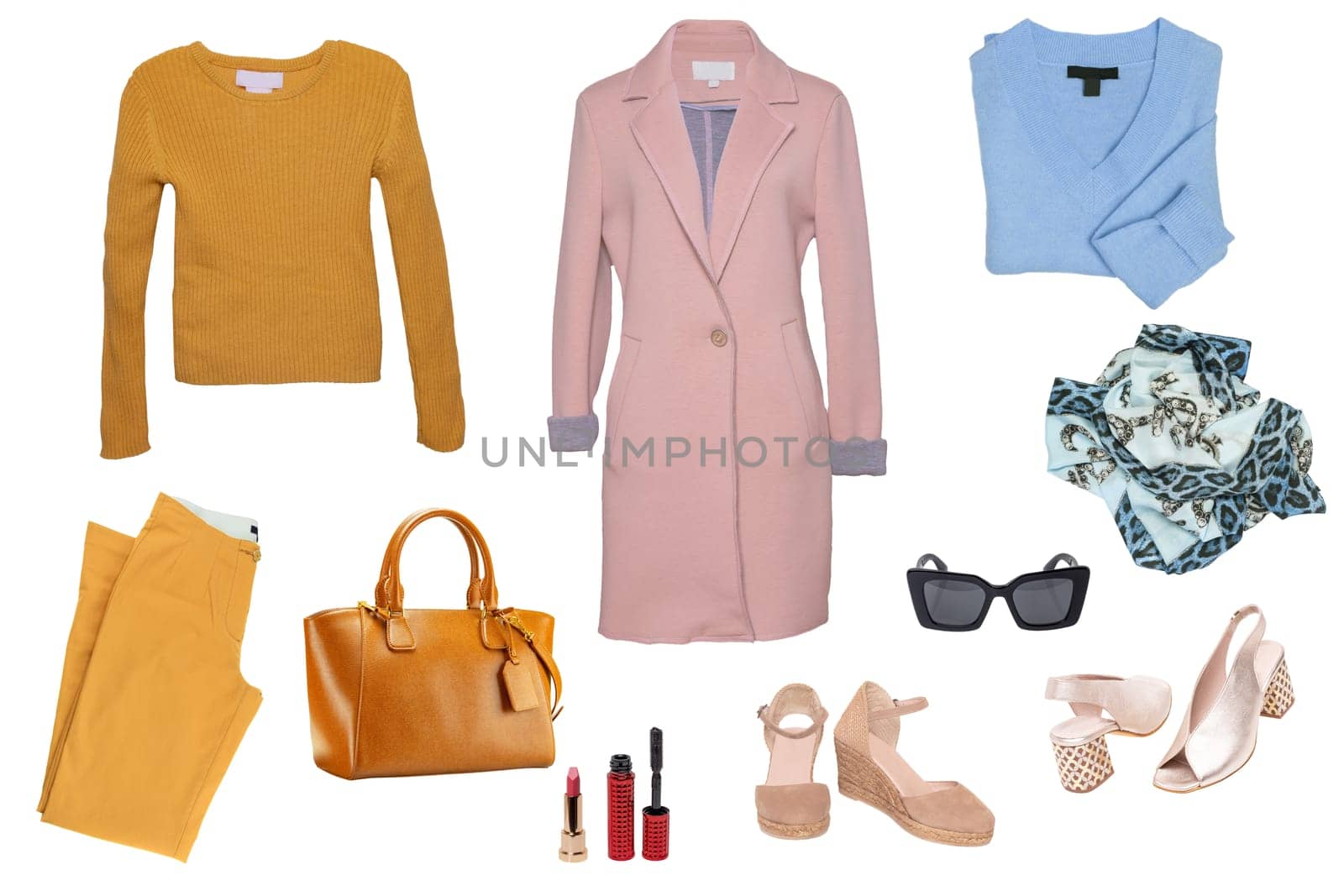 Collage woman clothes. Set of a stylish and trendy women coat, a jeans, boots, a handbag, a cardigan and other accessories isolated on a white background. Fashion trends.