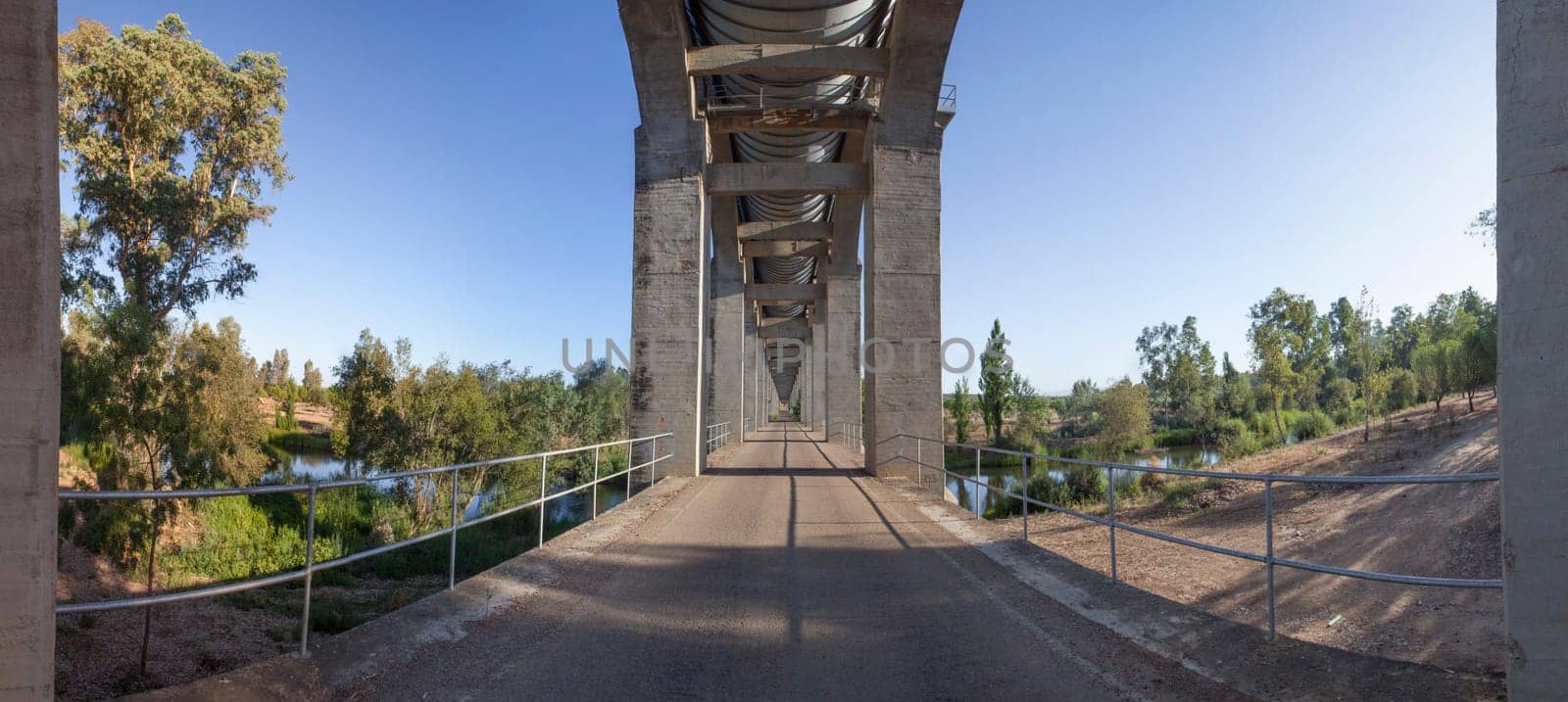 Service road that runs under Acedera Aqueduct. Orellana Irrigation canal, Vegas Altas del Guadiana, Extremadura, Spain