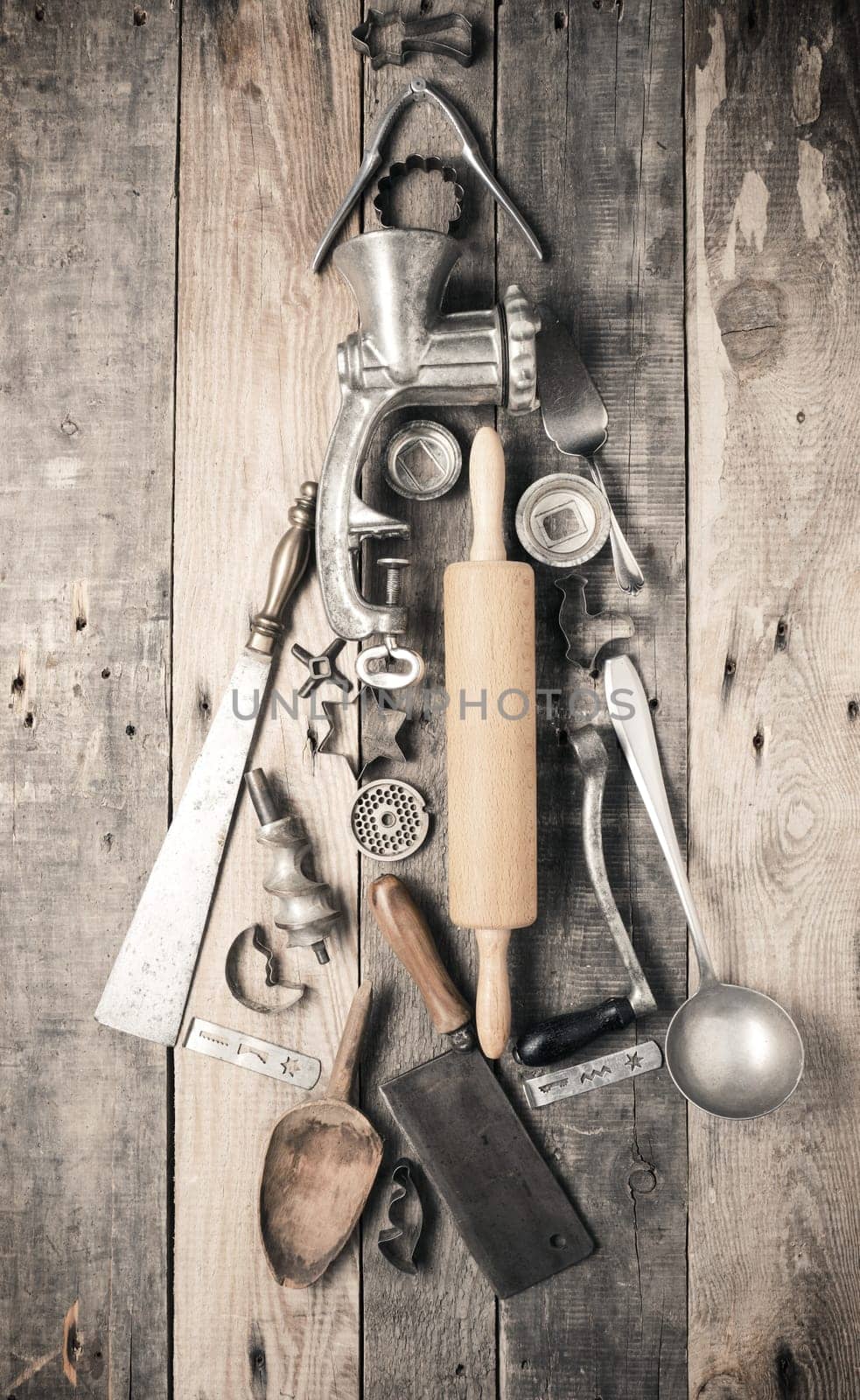 Chistmas tree shape of vintage kitchen and baking utensils on a rustic wooden kitchen table, Christmas bakery concept
