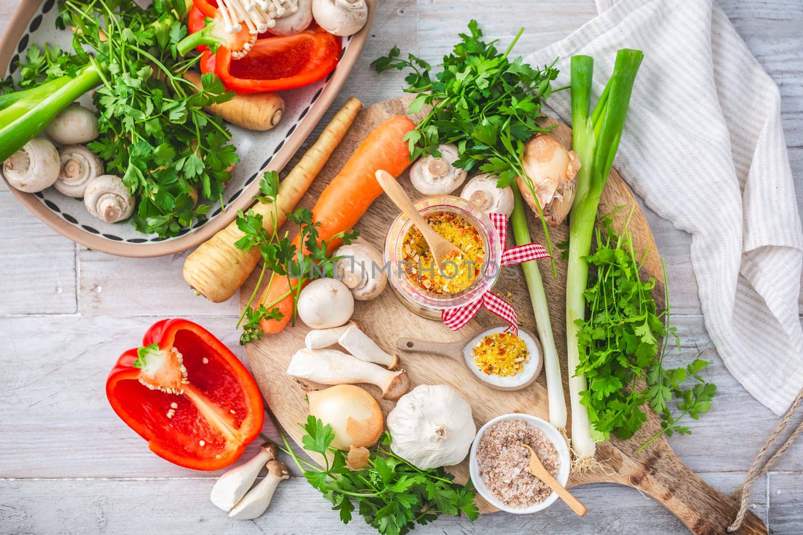 Homemade vegetable broth powder, organic vegetable stock, with raw vegetables, mushrooms and herbs
