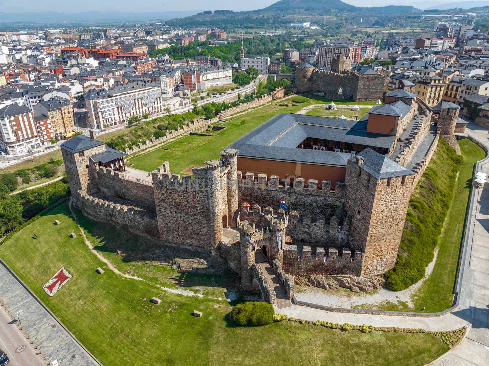 Templar castle in Ponferrada, Leon Spain medieval stone walls, towers, flags