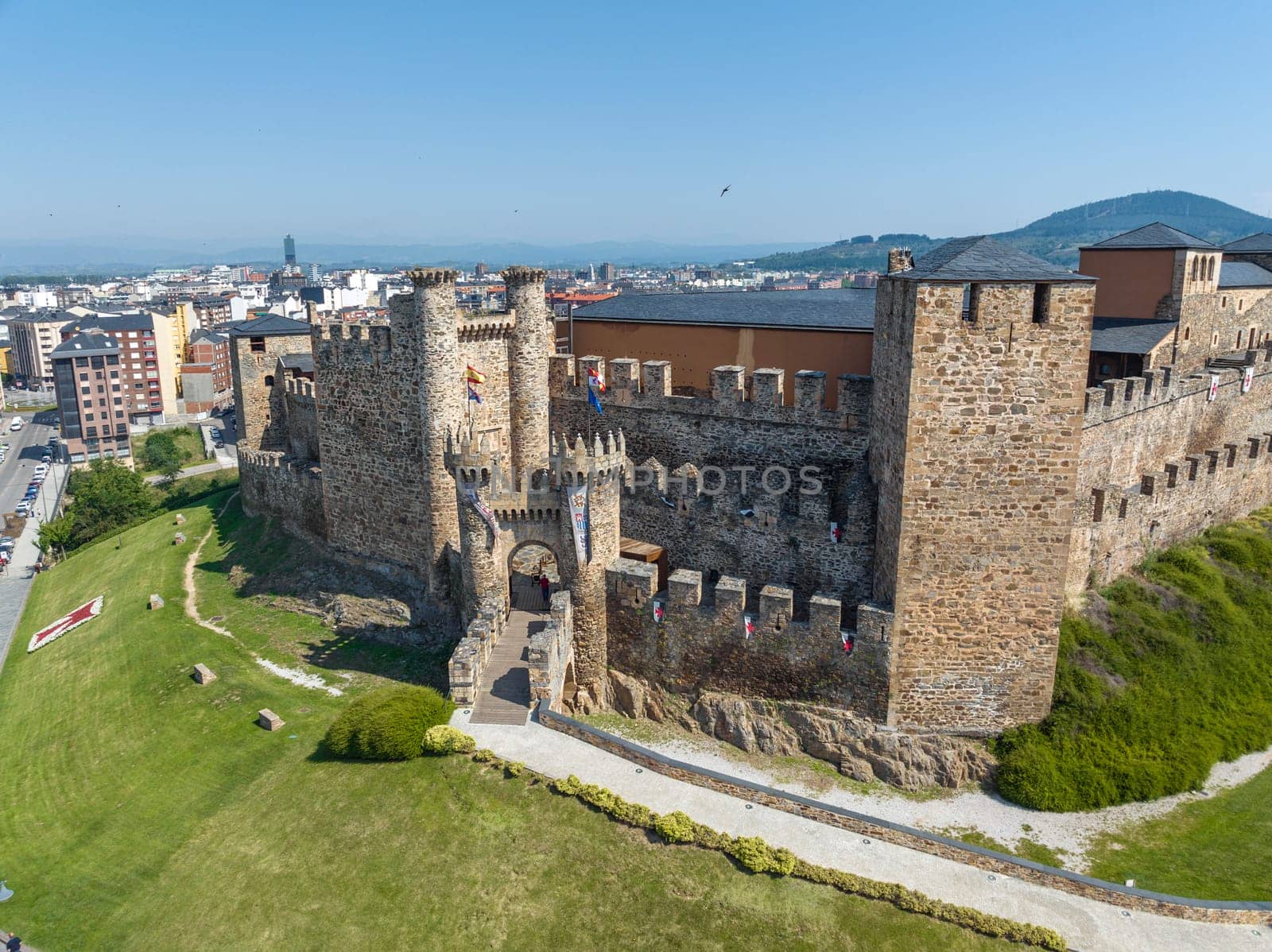 Templar castle in Ponferrada, Leon Spain medieval stone walls, towers, flags