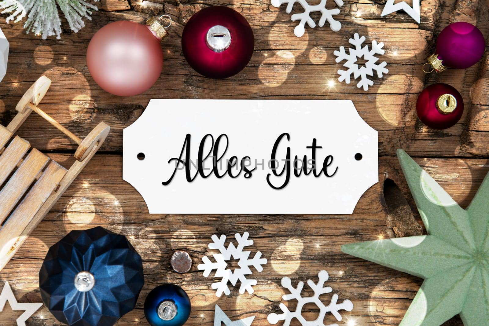 Colorful Christmas Decor With Bokeh, Christmas Balls And Snowflakes, With Sign With German Text Alles Gute, Which Means Best Wishes In English