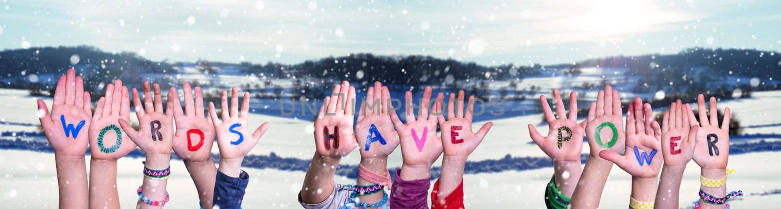 Children Hands Building Colorful English Word Words Have Power. White Snowy Winter Scenery And Landscape With Snowflakes As Background.