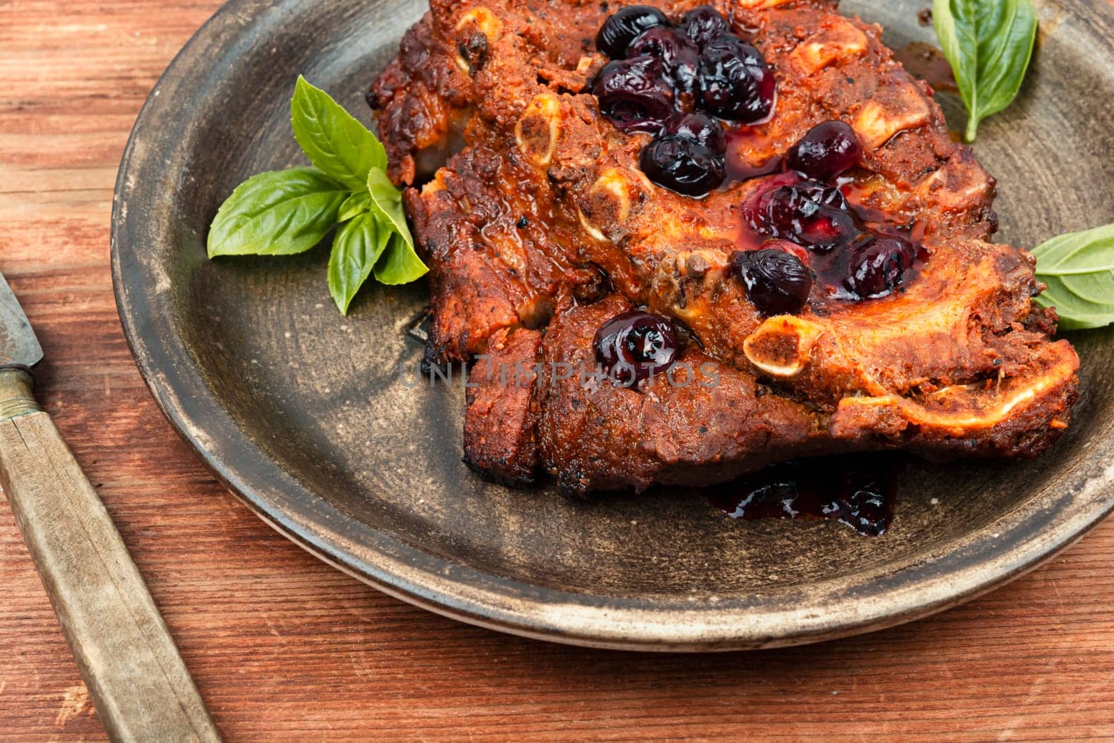 Fried pork ribs with blueberry sauce