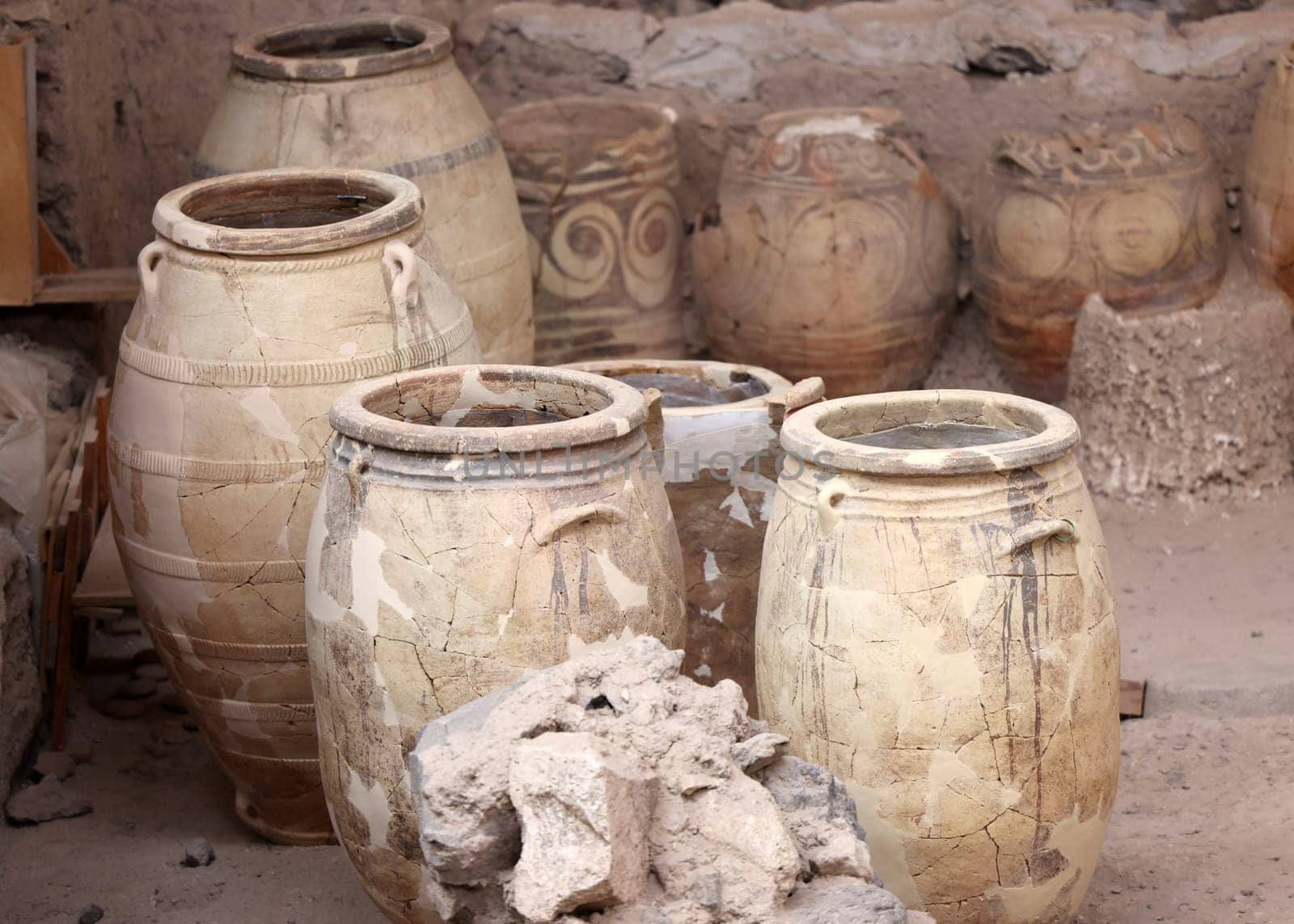 Santorini, Greece - July 01, 2021: Recovered ancient pottery in prehistoric town of Akrotiri, excavation site of a Minoan Bronze Age settlement on the Greek island of Santorini
