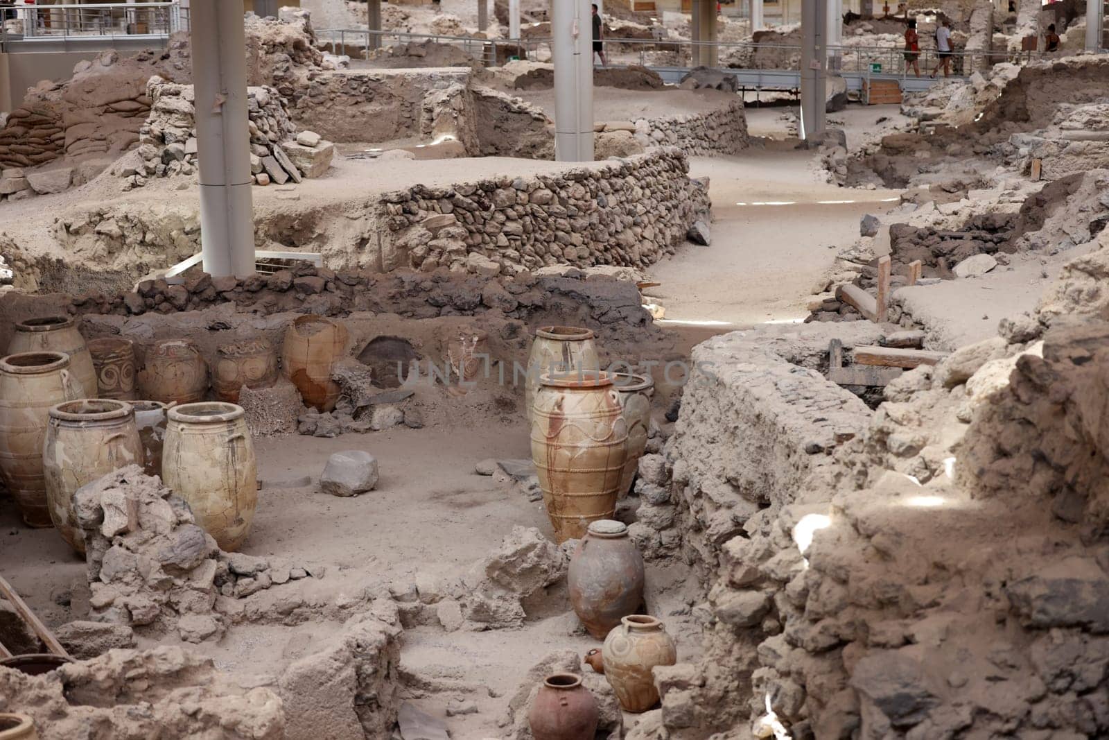 Santorini, Greece - July 01, 2021: Recovered ancient pottery in prehistoric town of Akrotiri, excavation site of a Minoan Bronze Age settlement on the Greek island of Santorini