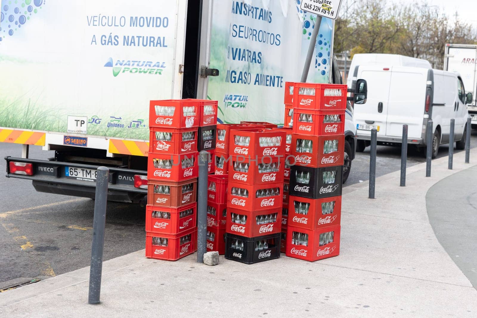 22 february 2023 Lisbon, Portugal: stack box of coca-cola on the street by the truck. Mid shot