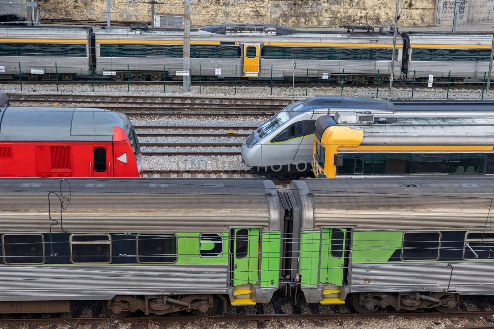 Bullet trains stand on the rails at the railway depot. Aerial view