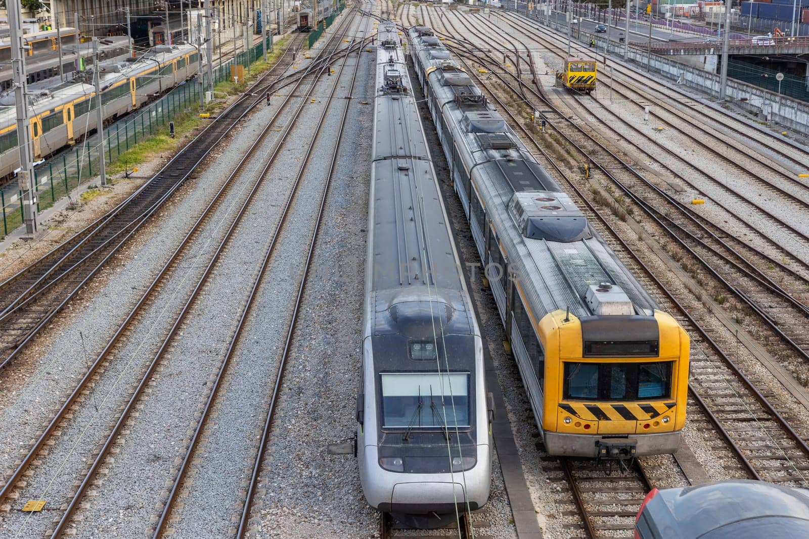 Old and modern trains stand on the rails at the railway depot. Aerial shot