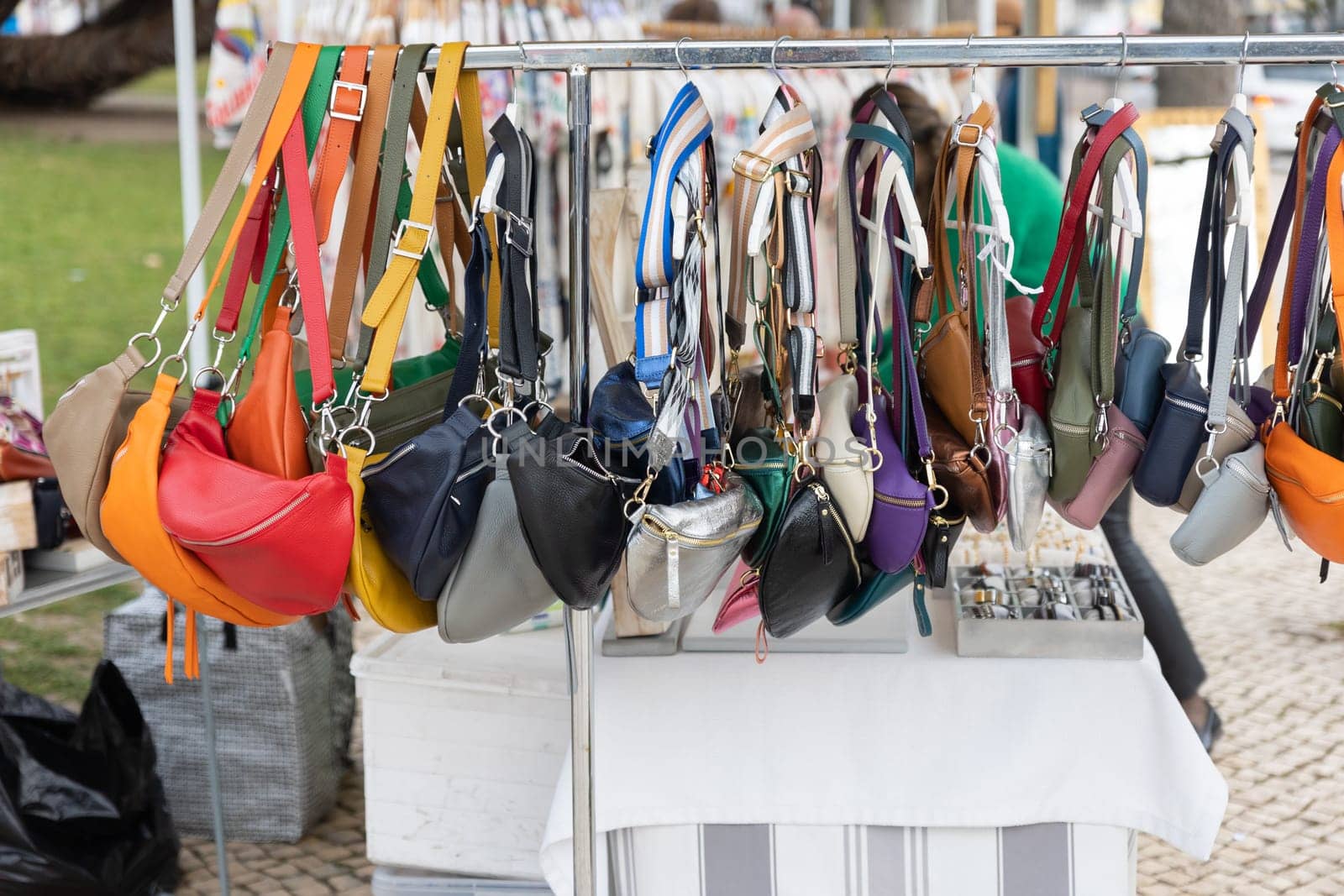 Selling female bags on the street - street market. Mid shot