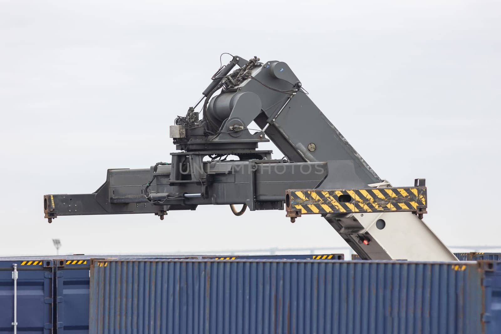 Lift spreader for cargo above the container. Mid shot