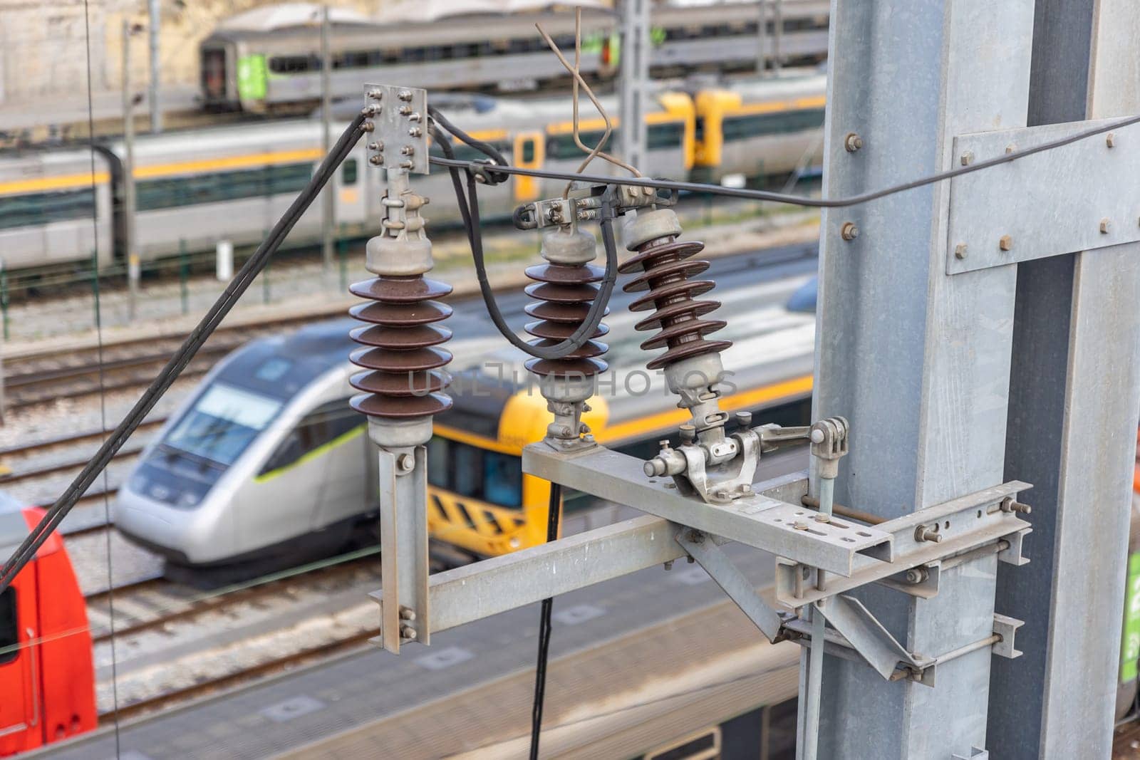 Electrical connections - Bullet trains stand on the rails at the railway depot on the background. Aerial view