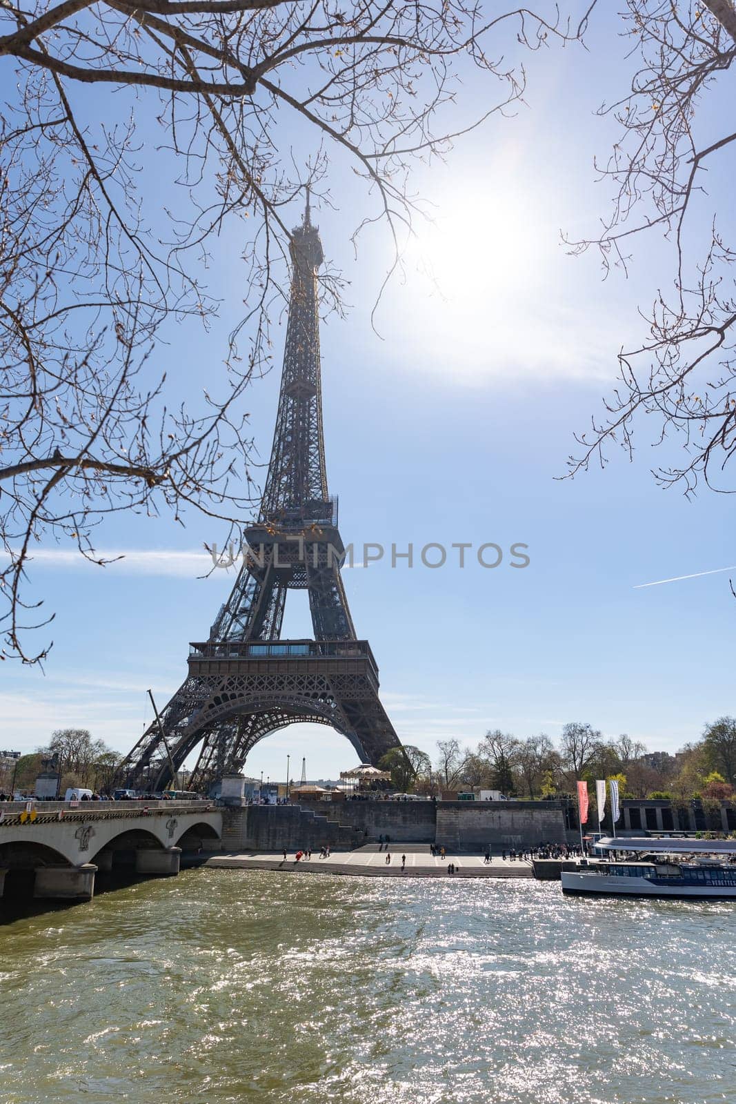 April 4, 2023 Paris, France: Seine River at the Eiffel Tower. Vertical shot