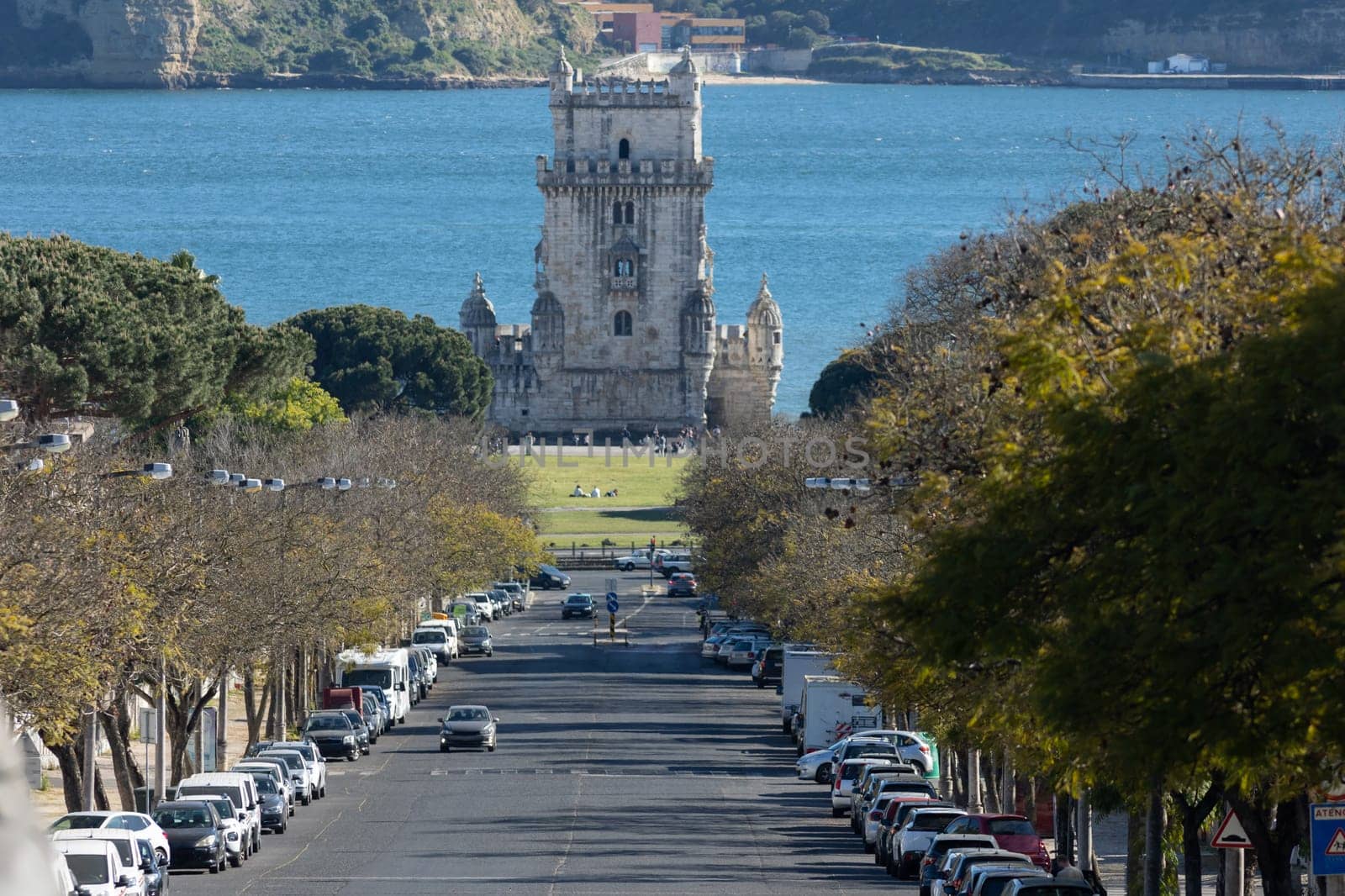 Torre de belem tower down the road. Mid shot