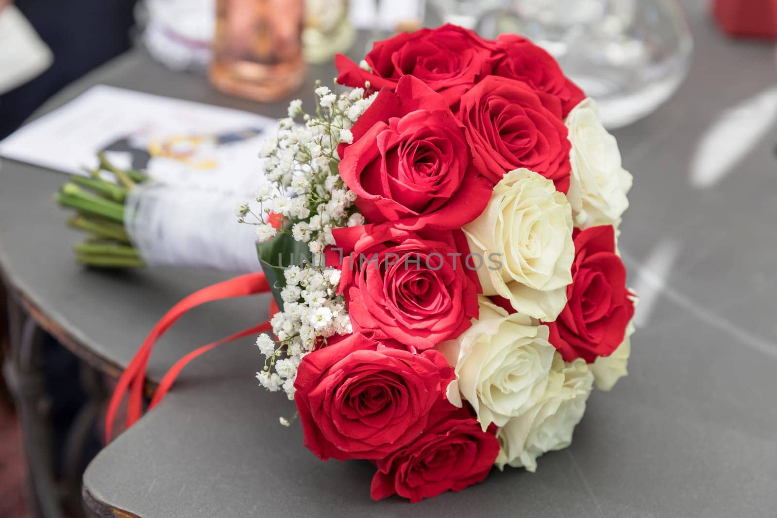 Flower bouquet of marriage, on blurred background. Party, event.