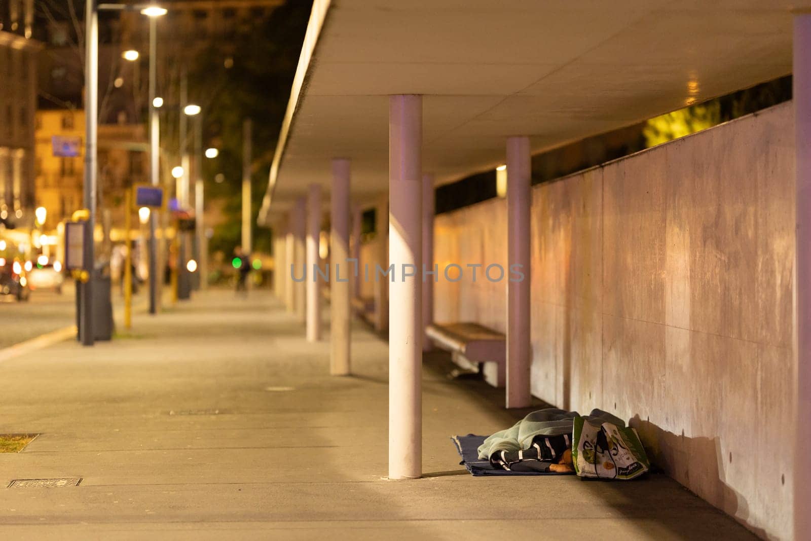 21 April 2023 Lisbon, Portugal: Cais do sodre Railway station - homeless man sleep. Mid shot