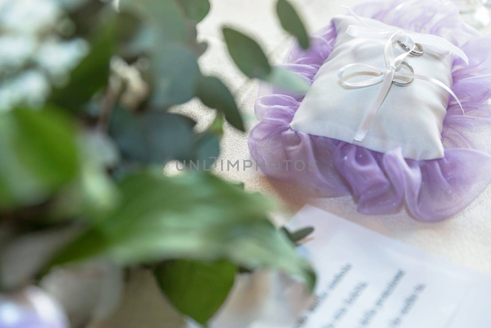 Wedding rings on a pillow as wedding symbol.