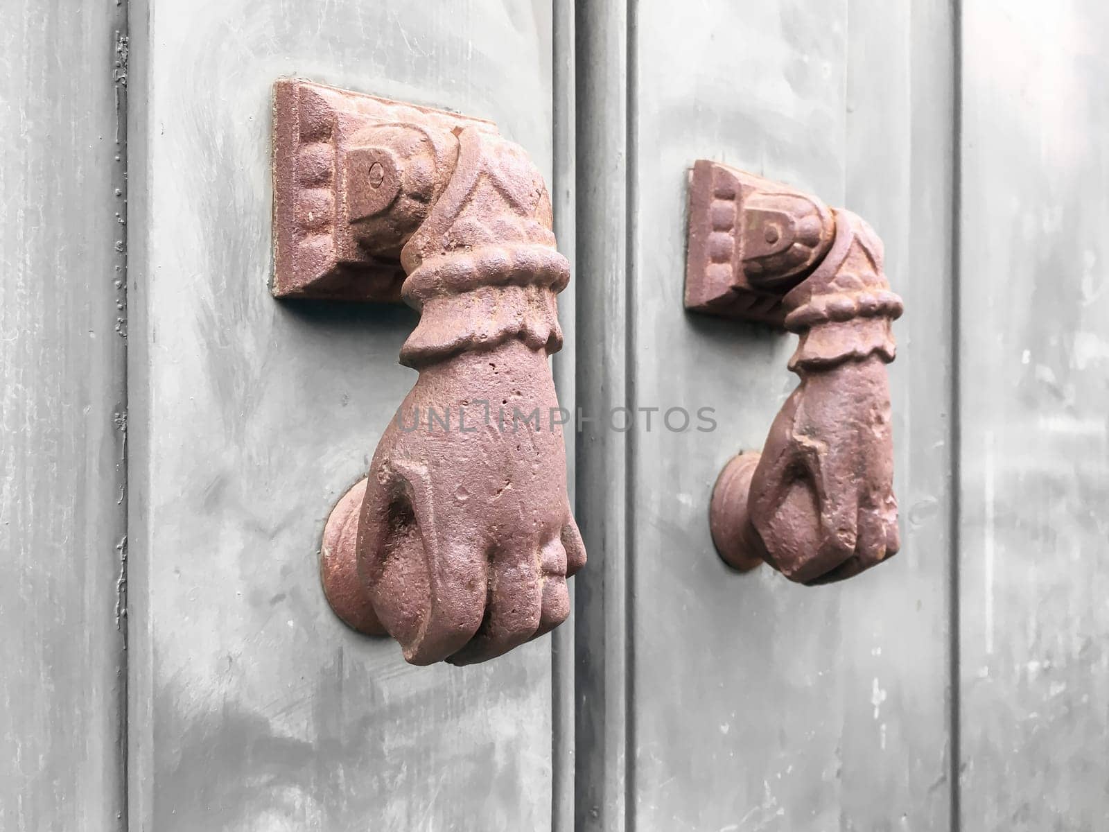Pair of traditional red hand knockers in hand shape. Vintage.