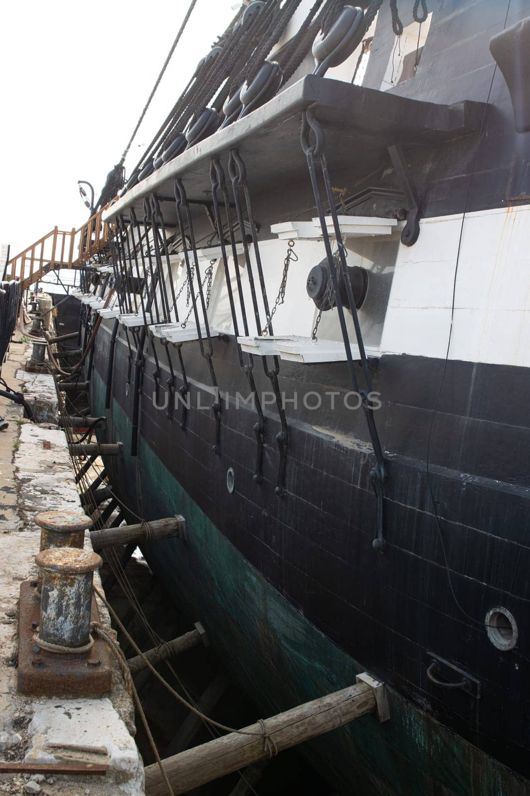 Retro tall battle ship in the sea - sail vessel - stand in port