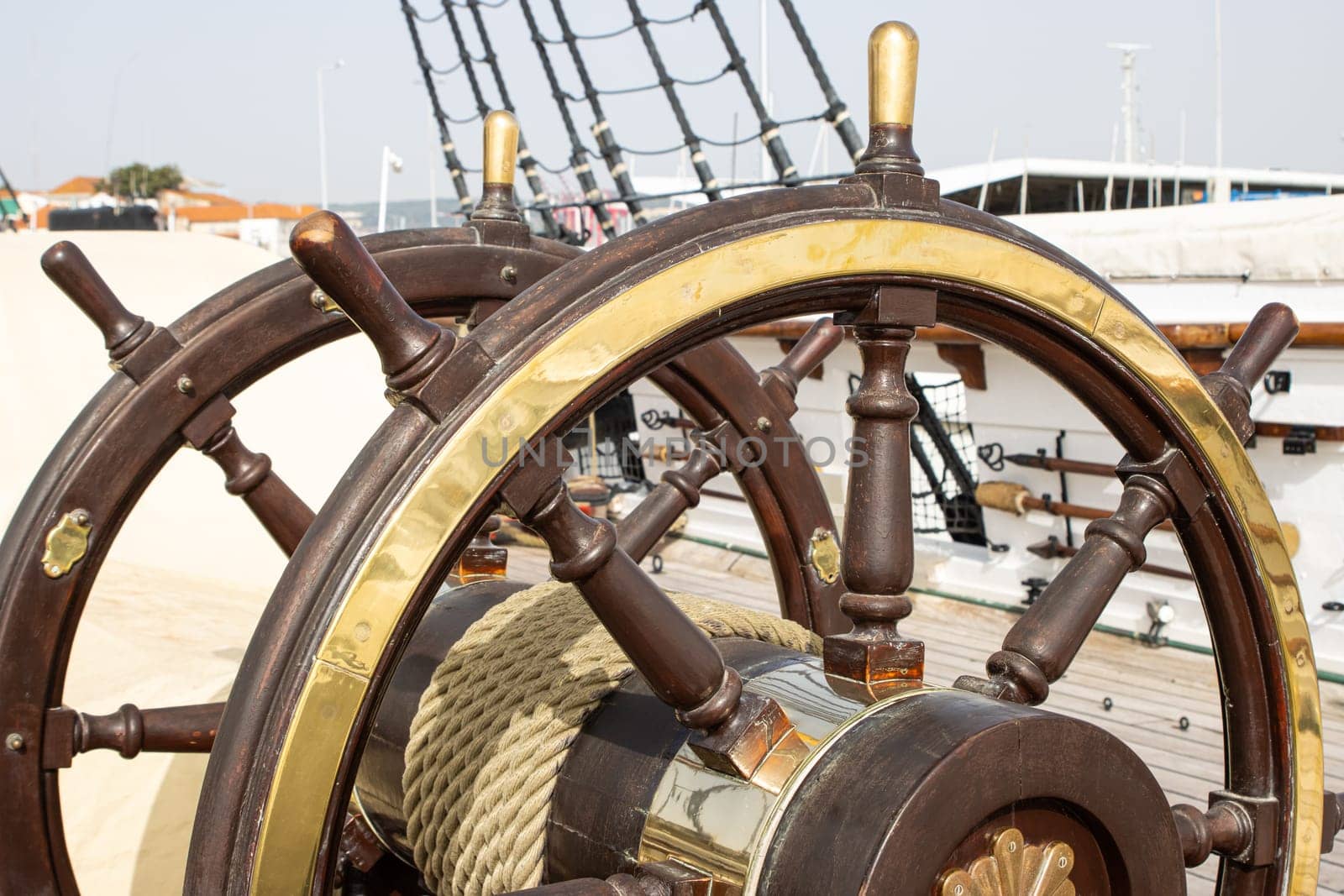 Double ship's steering wheel on the old retro battleship, daylight
