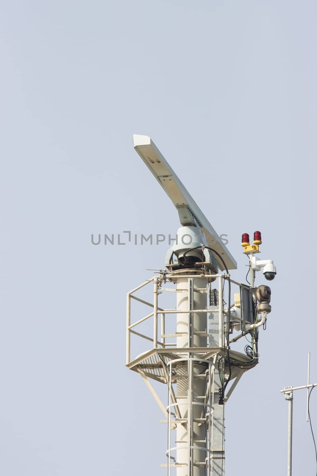 Spinning rotating radar equipment on top of a ship - clear sky